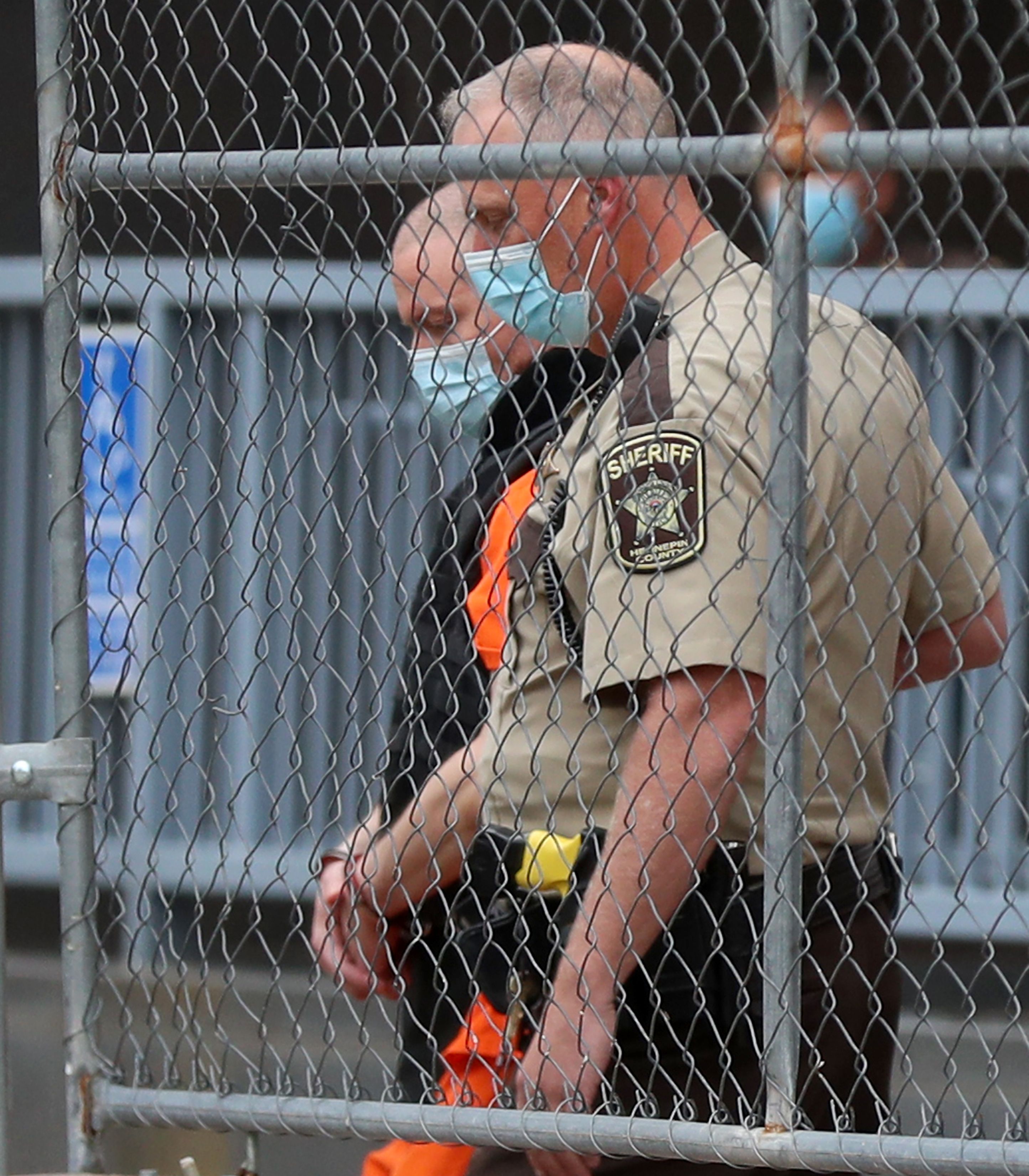 Fired Minneapolis police officer Derek Chauvin is led out of a gate at the Family Justice Center on September 11, 2020 | Photo: Getty Images