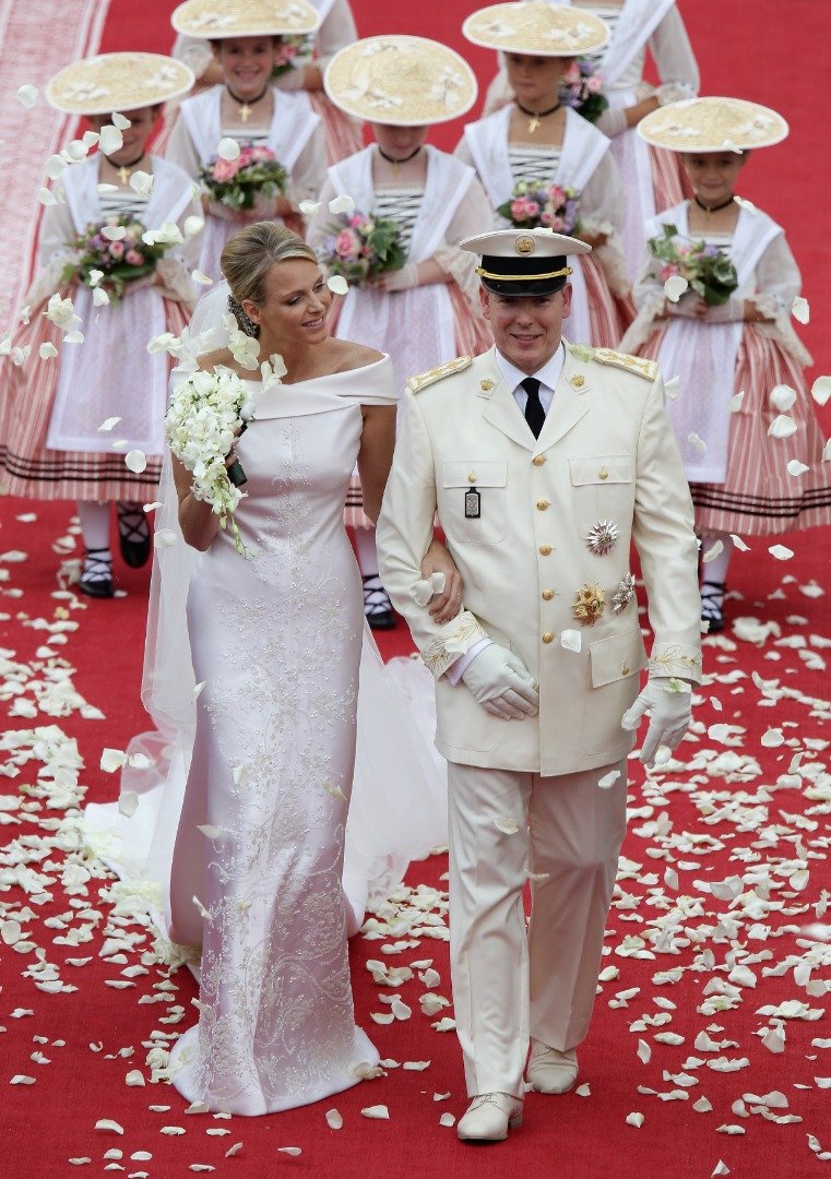 Princess Charlene of Monaco and Prince Albert Of Monaco smile as they leave the palace after the religious ceremony of the Royal Wedding of Prince Albert II of Monaco to Charlene Wittstock in the main courtyard at Prince's Palace on July 2, 2011 | Source: Getty Images