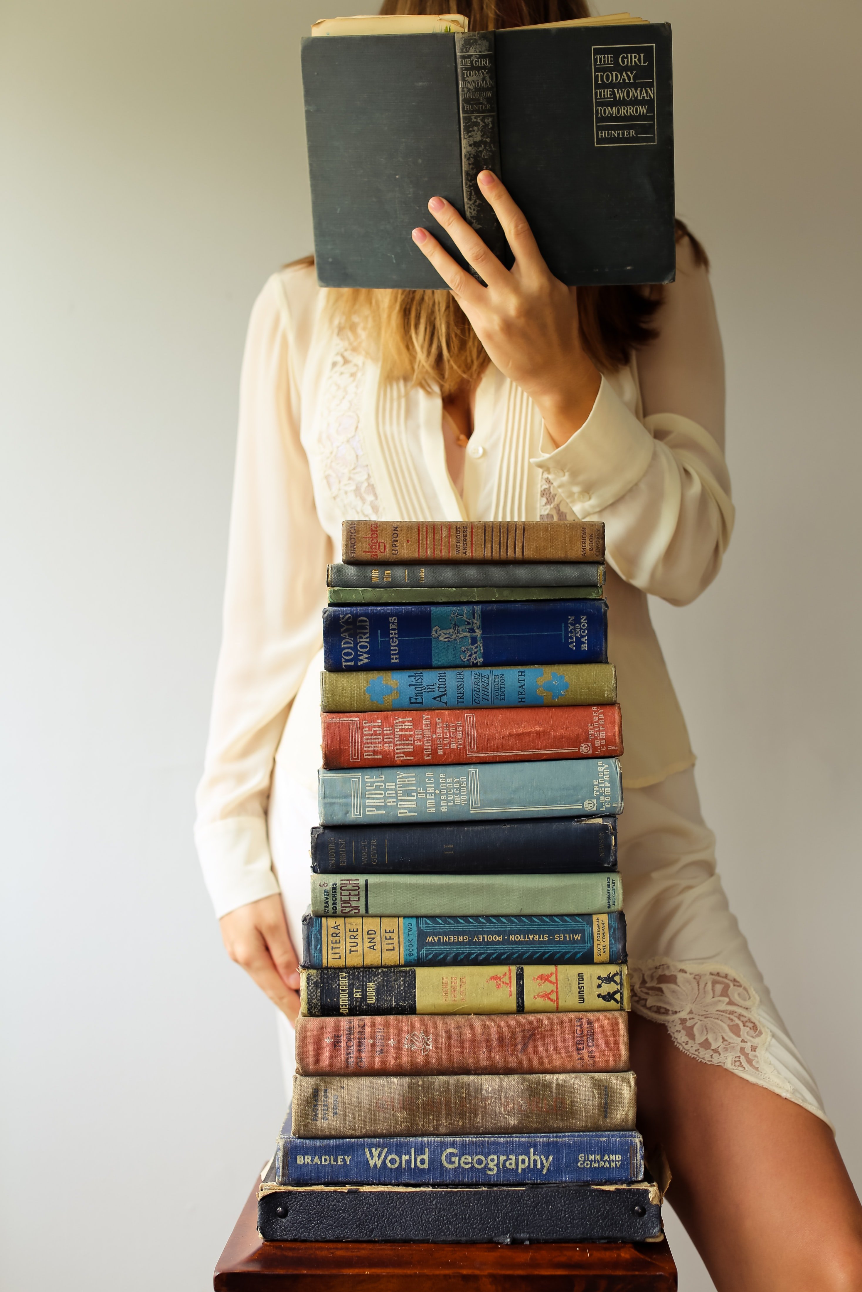 Woman with books | Unsplash 