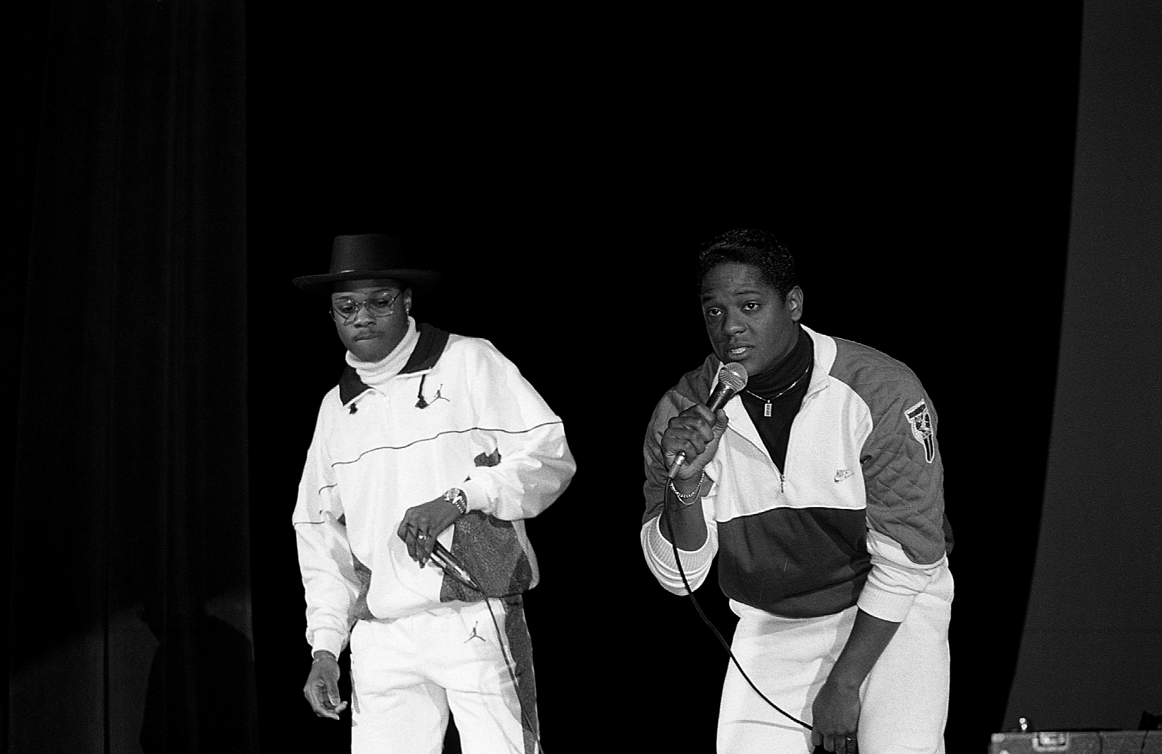 Malcolm-Jamal Warner and Blair Underwood greet fans during an appearance at the Regal Theater in Chicago, Illinois in March 1988 | Source: Getty Images