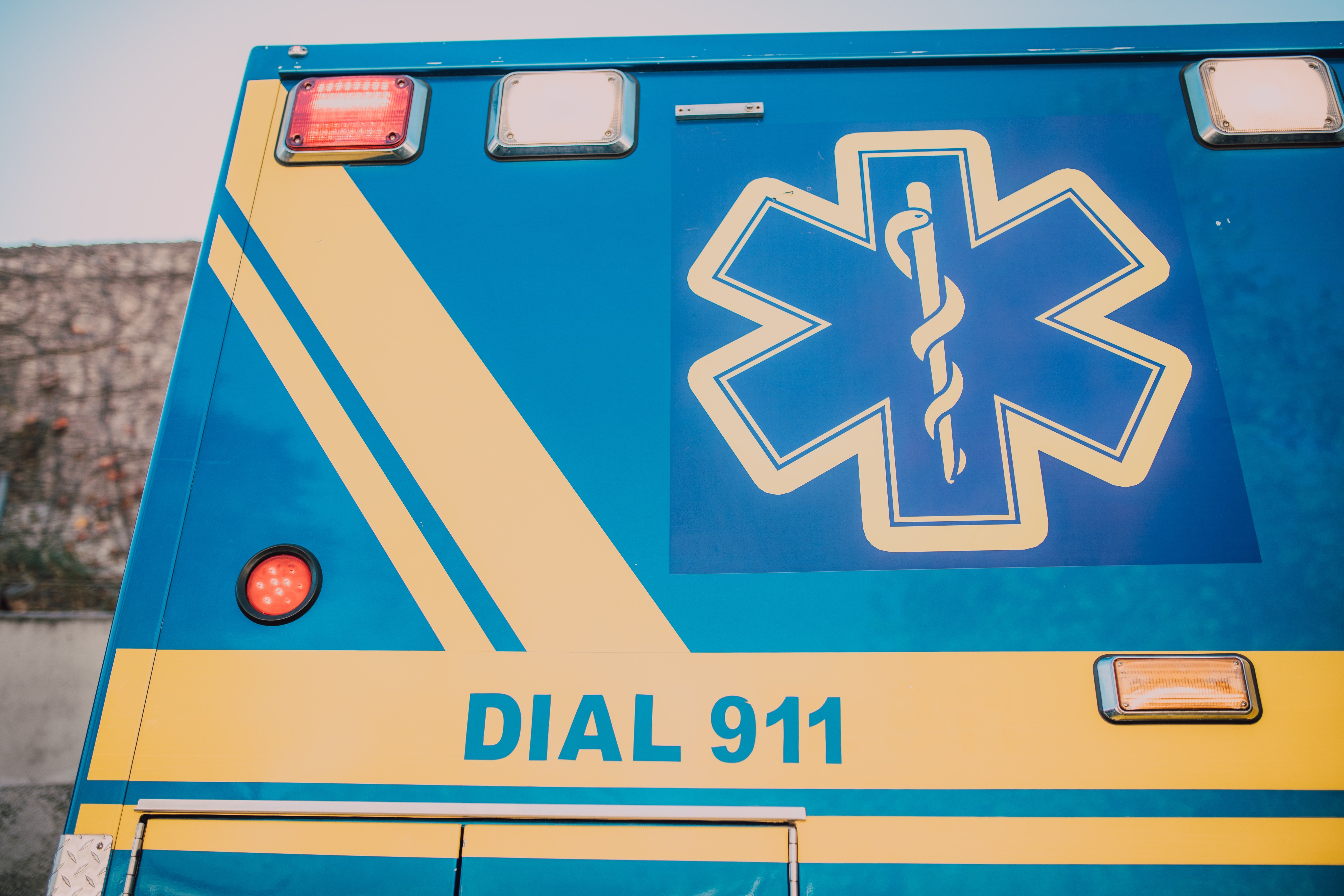 Pictured - A blue and yellow ambulance | Source: Pexels 