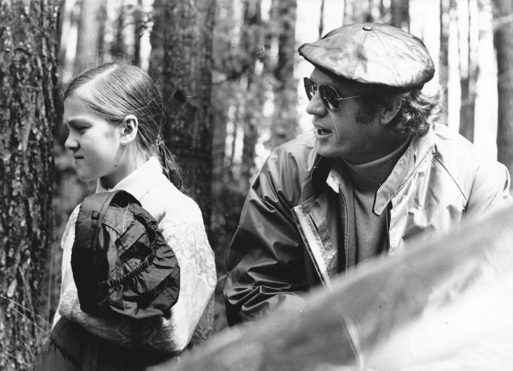 Actor Steve McQueen relaxes with his daughter Terry as he stars in the movie 'Le Mans' on June 24, 1971 in Le Mans, France. | Source: Getty Images