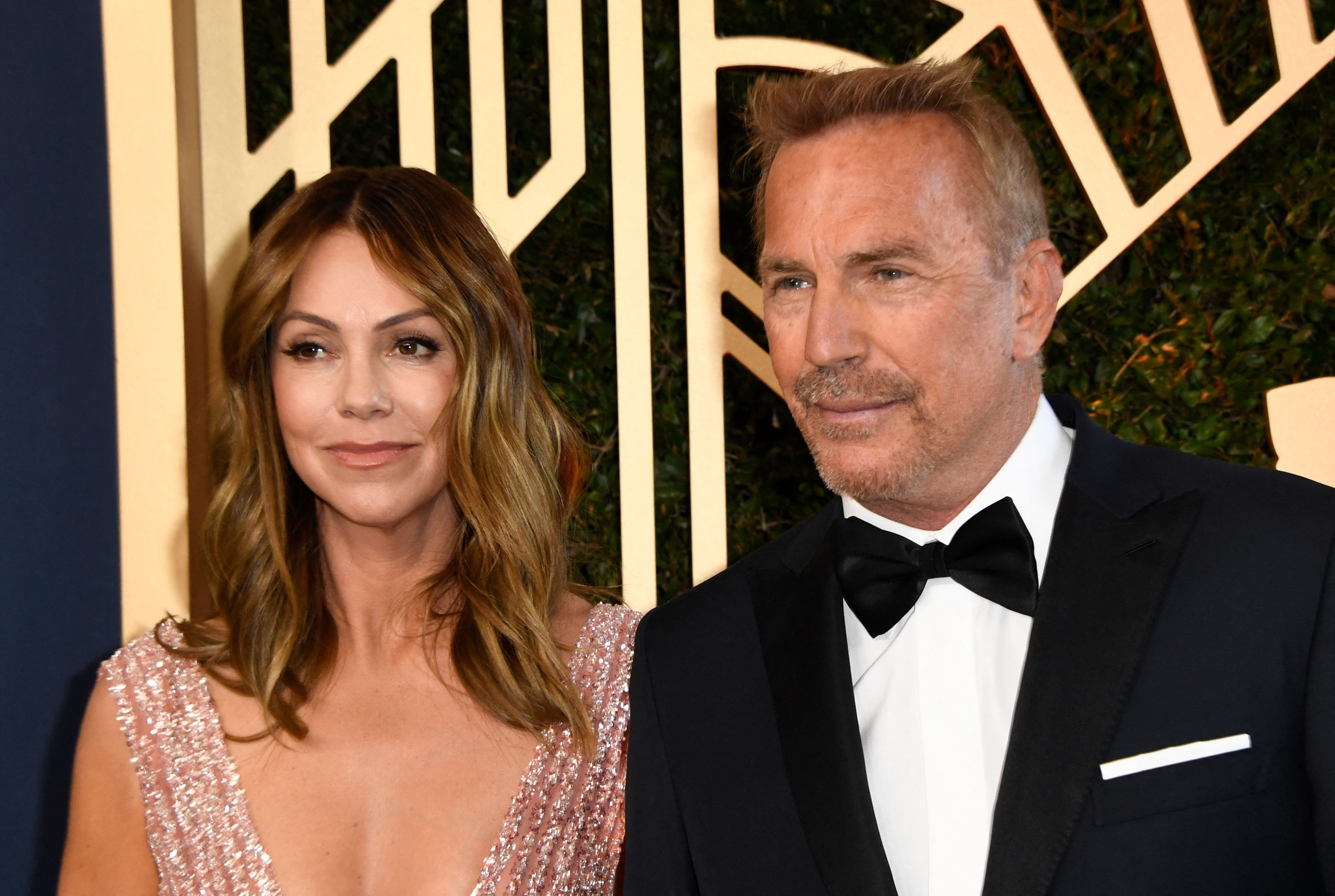 Christine Baumgartner and Kevin Costner arrive for the 28th Annual Screen Actors Guild (SAG) Awards in Santa Monica, California, on February 27, 2022. | Source: Getty Images