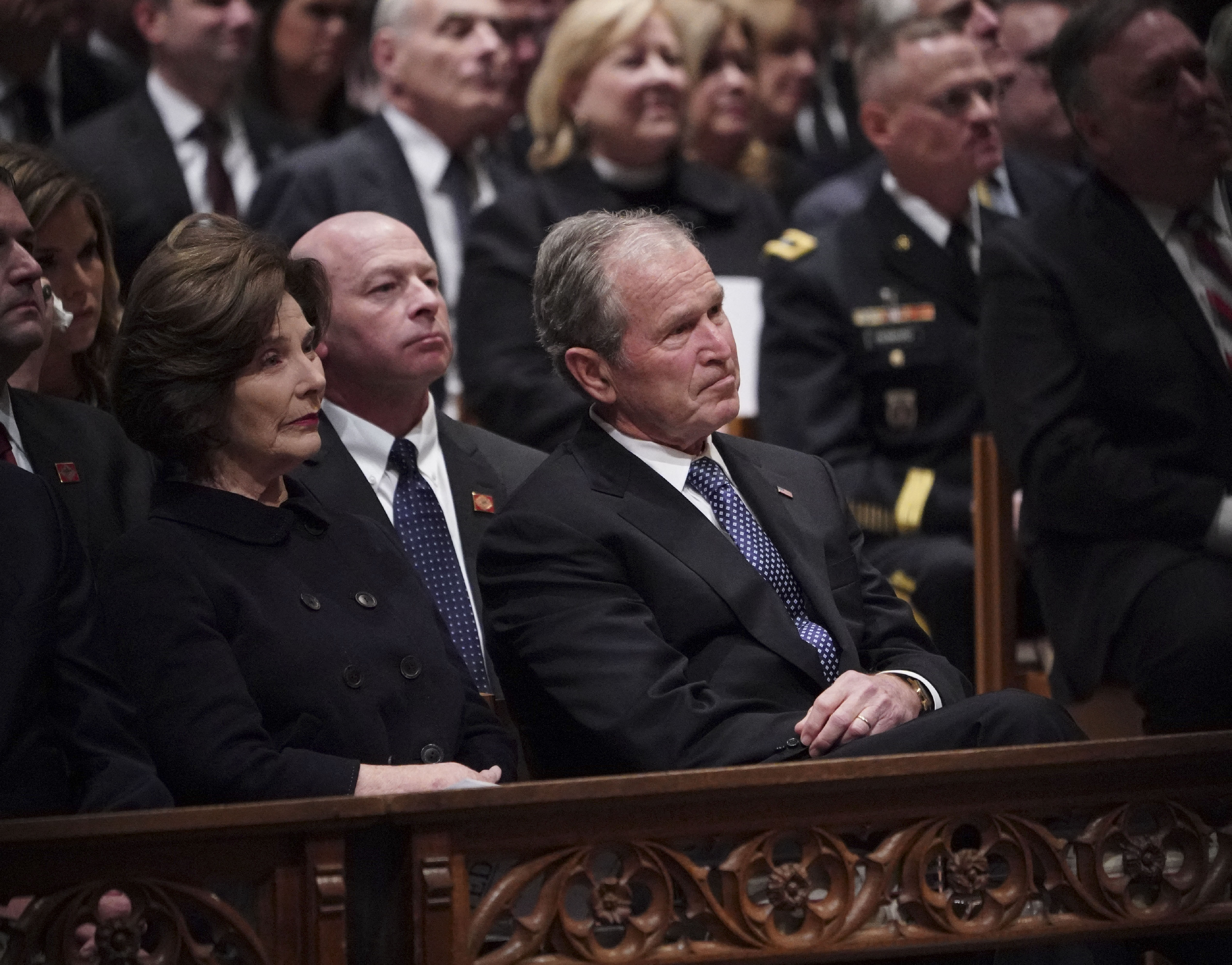 George W. Bush and former First Lady Laura Bush attend George H. W. Bush's funeral at the National Cathedral on December 5, 2018 | Source: Getty Images