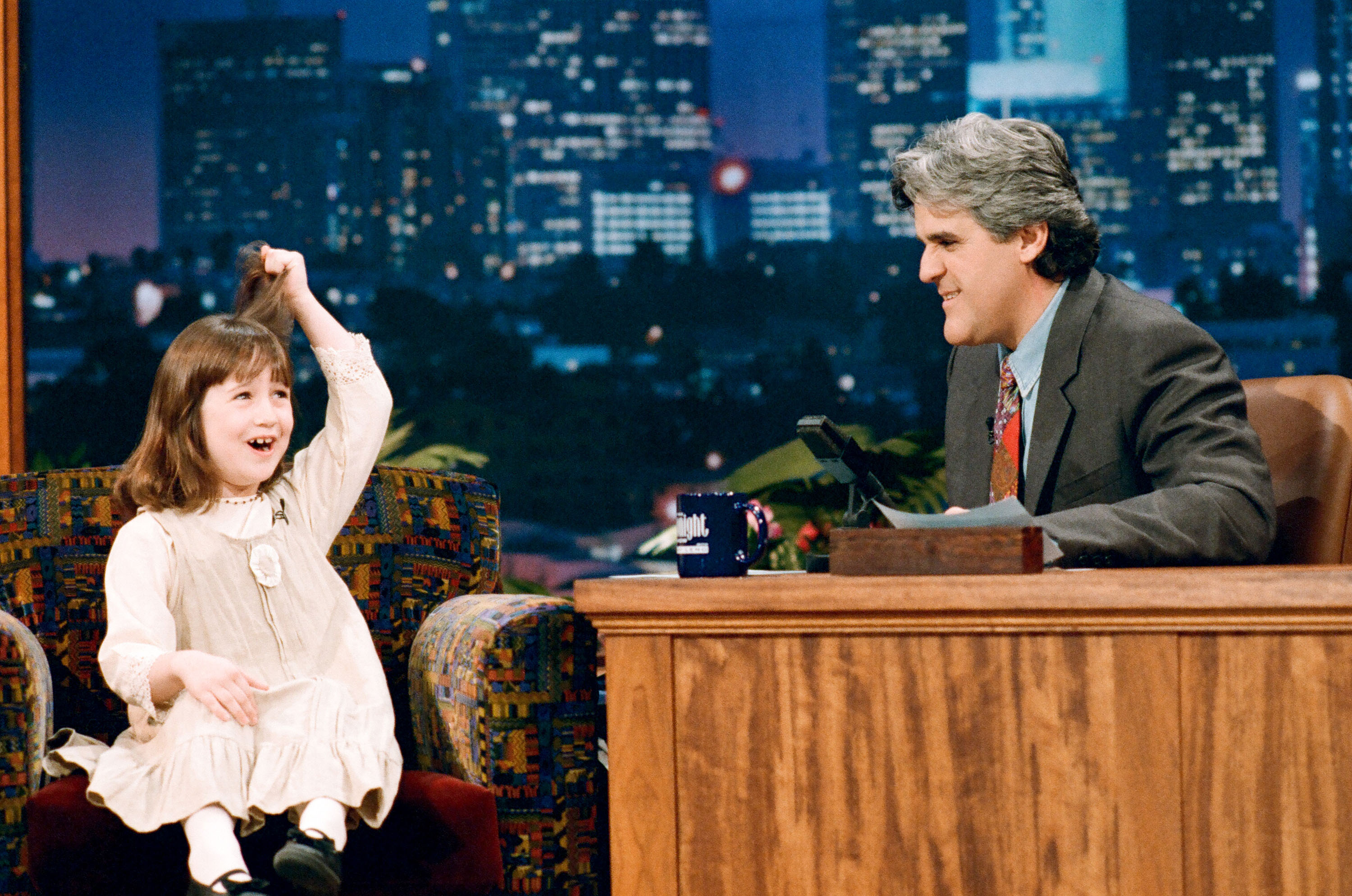 Mara Wilson and Jay Leno on "The Tonight Show with Jay Leno," Season Three in 1995 | Source: Getty Images