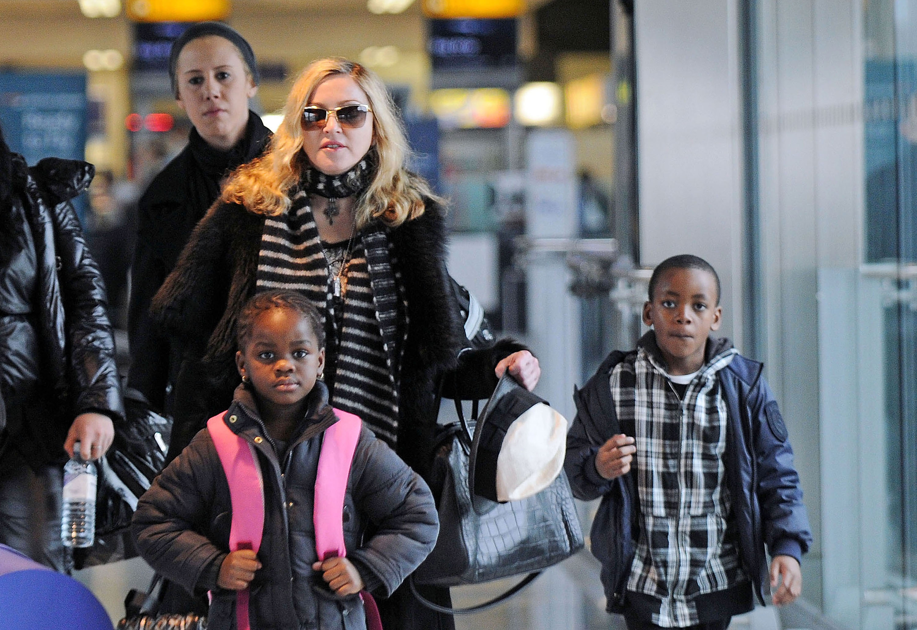 Madonna walks with son David and daughter Mercy in London, UK on April 2, 2011 | Photo: Getty Images
