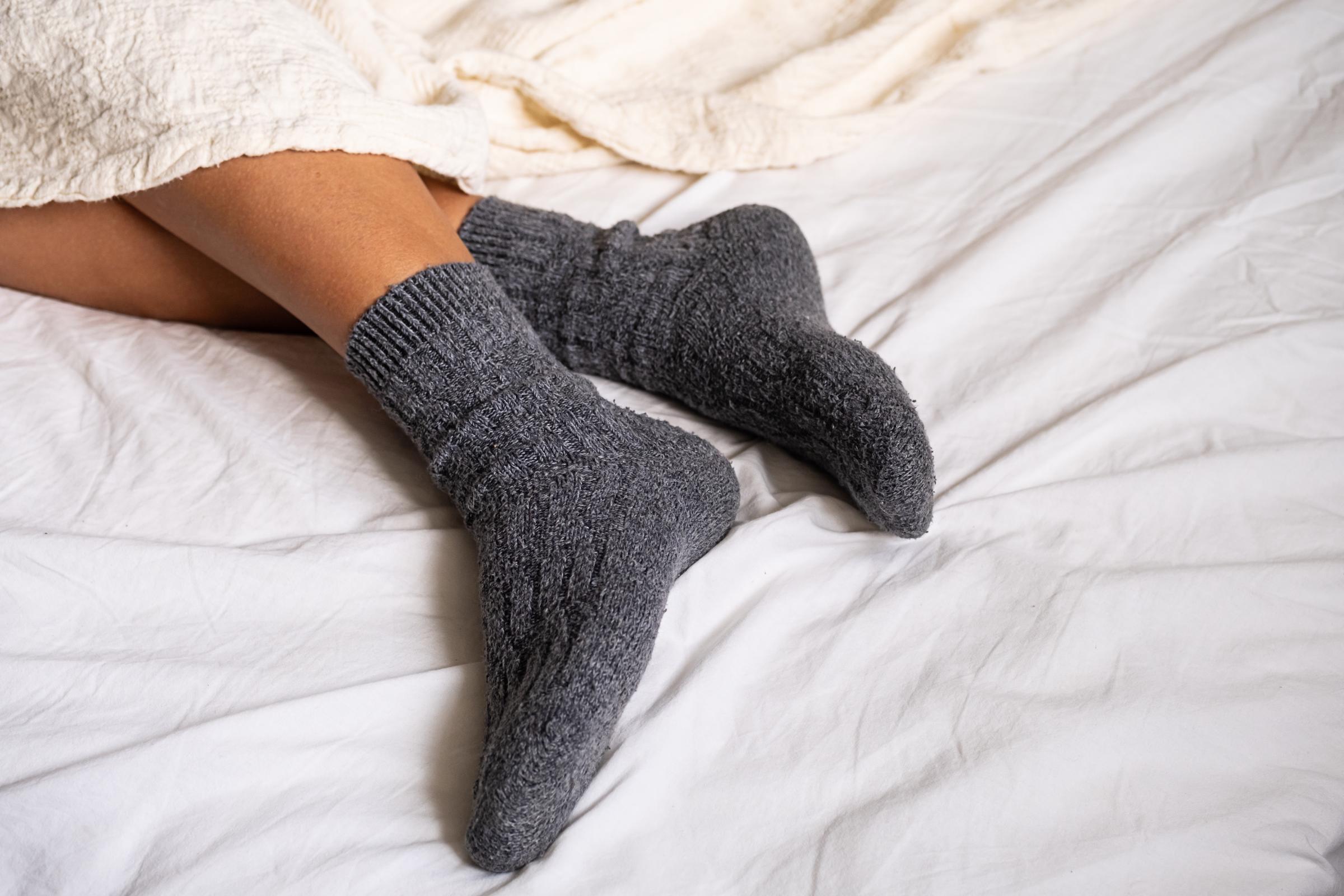 A person wearing socks to sleep | Source: Shutterstock