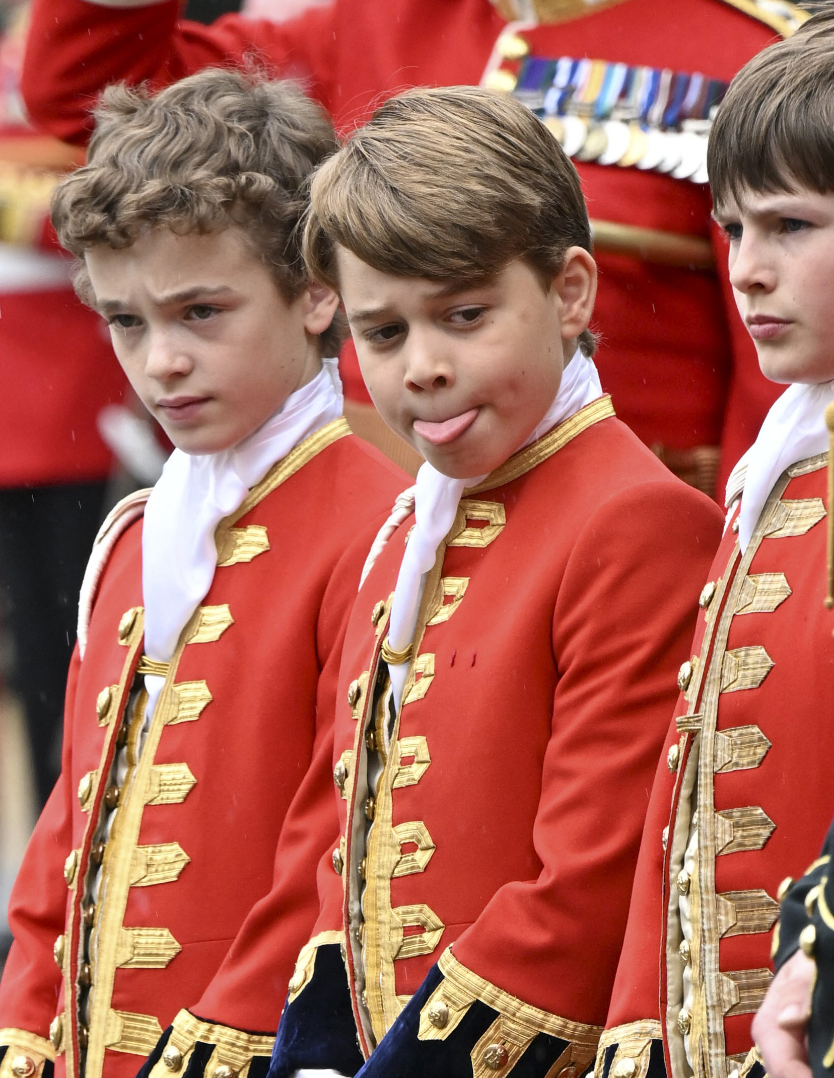 Page of Honours Ralph Tollemache, Prince George of Wales and Lord Oliver Cholmondeley at Buckingham Palace during the Coronation of King Charles III  in London in 2023 | Source: Getty Images