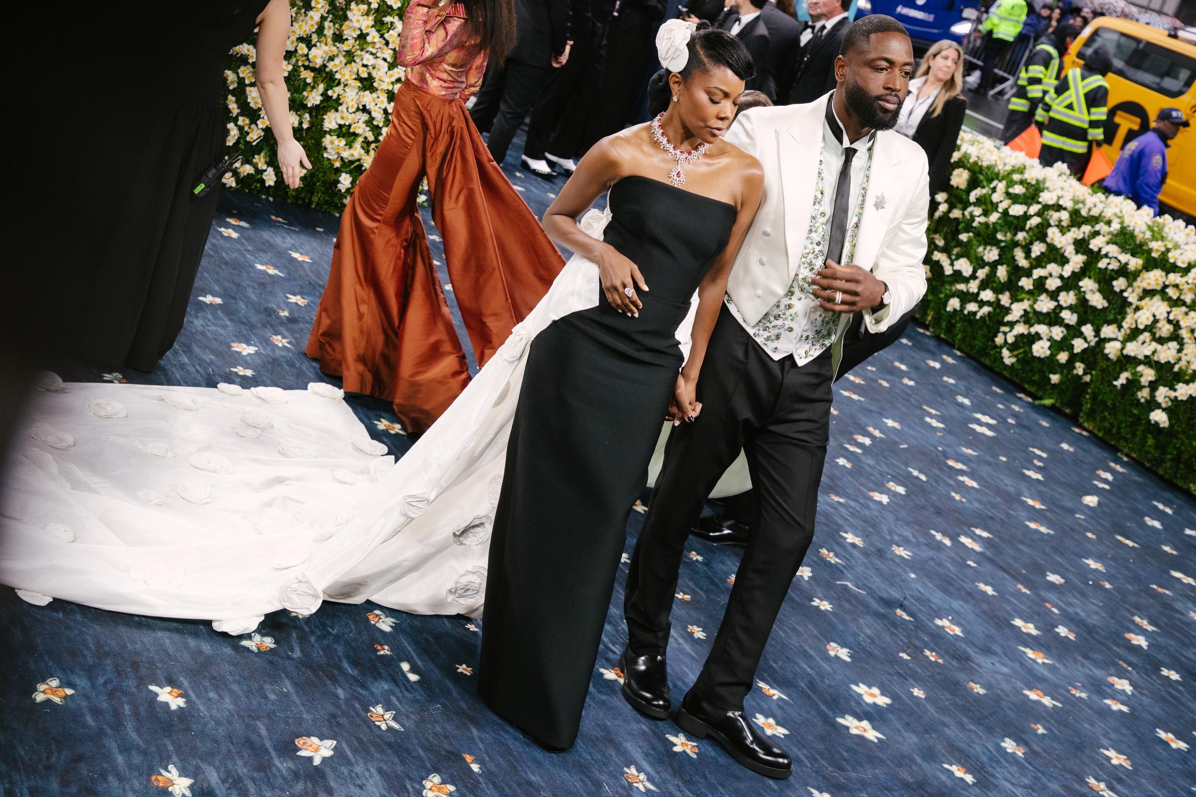 Gabrielle Union and Dwayne Wade pose at the Met Gala Celebrating "Superfine: Tailoring Black Style" on May 5, 2025, in New York City. | Source: Getty Images