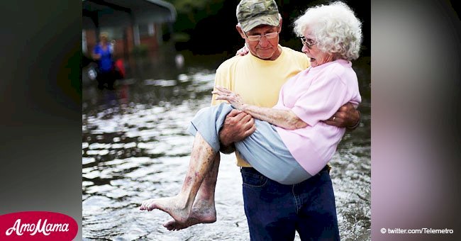 Bob Richling carried his wife, 84, out of their flooded home in the aftermath of a hurricane