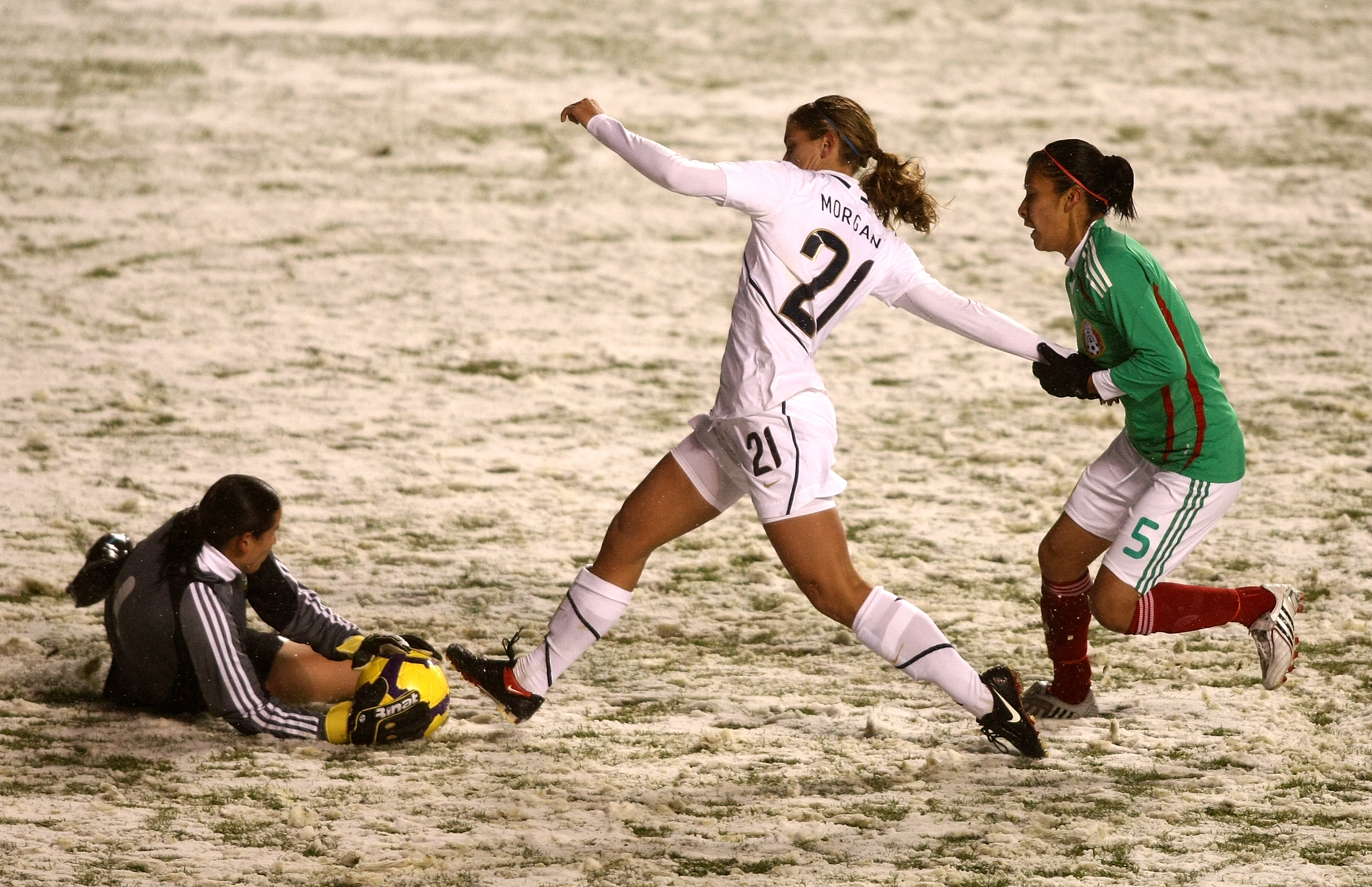 Alex Morgan battles against goalkeeper Erika Vanegas and Maria Castillo during the international friendly match between the United States and Mexico in Sandy, Utah, on March 31, 2010. | Source: Getty Images