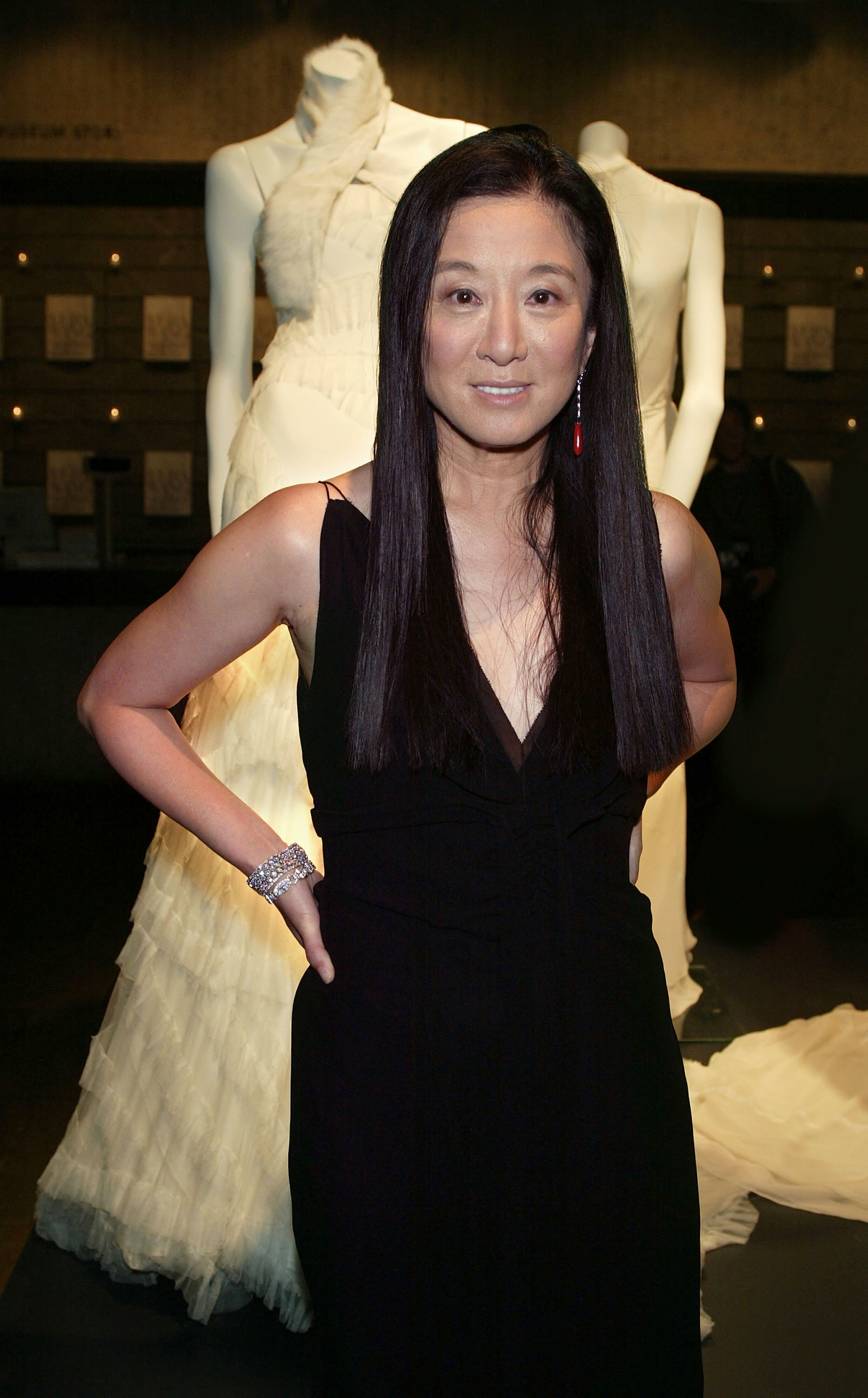 Vera Wang poses with the Vera Wang bridal exhibit at the Whitney Museum of American Art as part of the Wedding March On Madison on September 20, 2003, in New York City | Source: Getty Images
