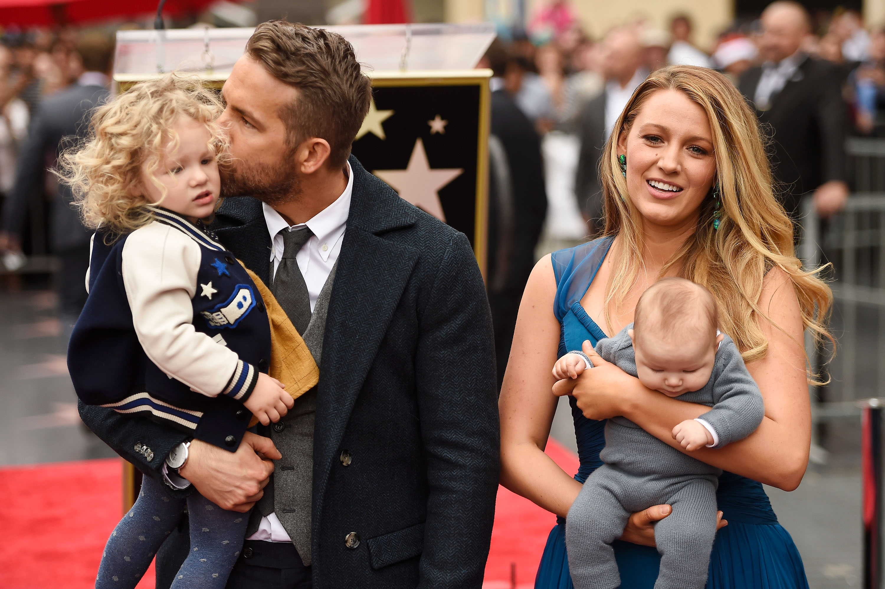 Actors Ryan Reynolds (L) and Blake Lively pose with their daughters as Ryan Reynolds is honored with star on the Hollywood Walk of Fame on December 15, 2016 in Hollywood, California | Source: Getty Images