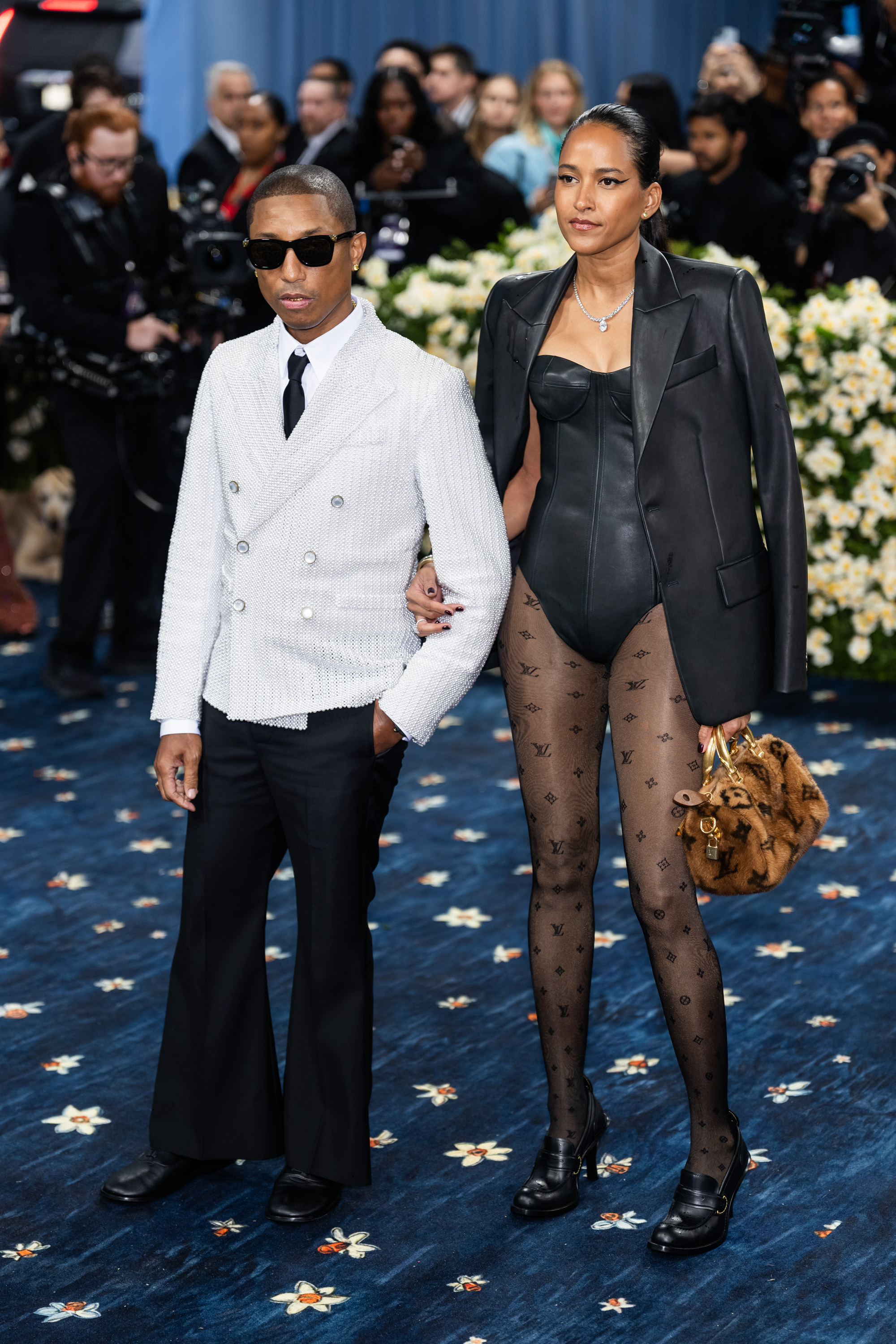 Pharrell Williams and Helen Lasichanh seen at the Met Gala Celebrating "Superfine: Tailoring Black Style" on May 5, 2025, in New York City. | Source: Getty Images