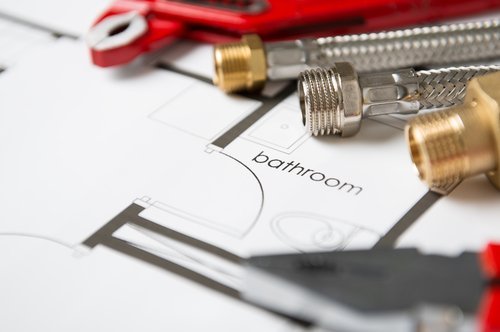 Wrench And Pipes On Bathroom Blueprint. | Source: Shutterstock.
