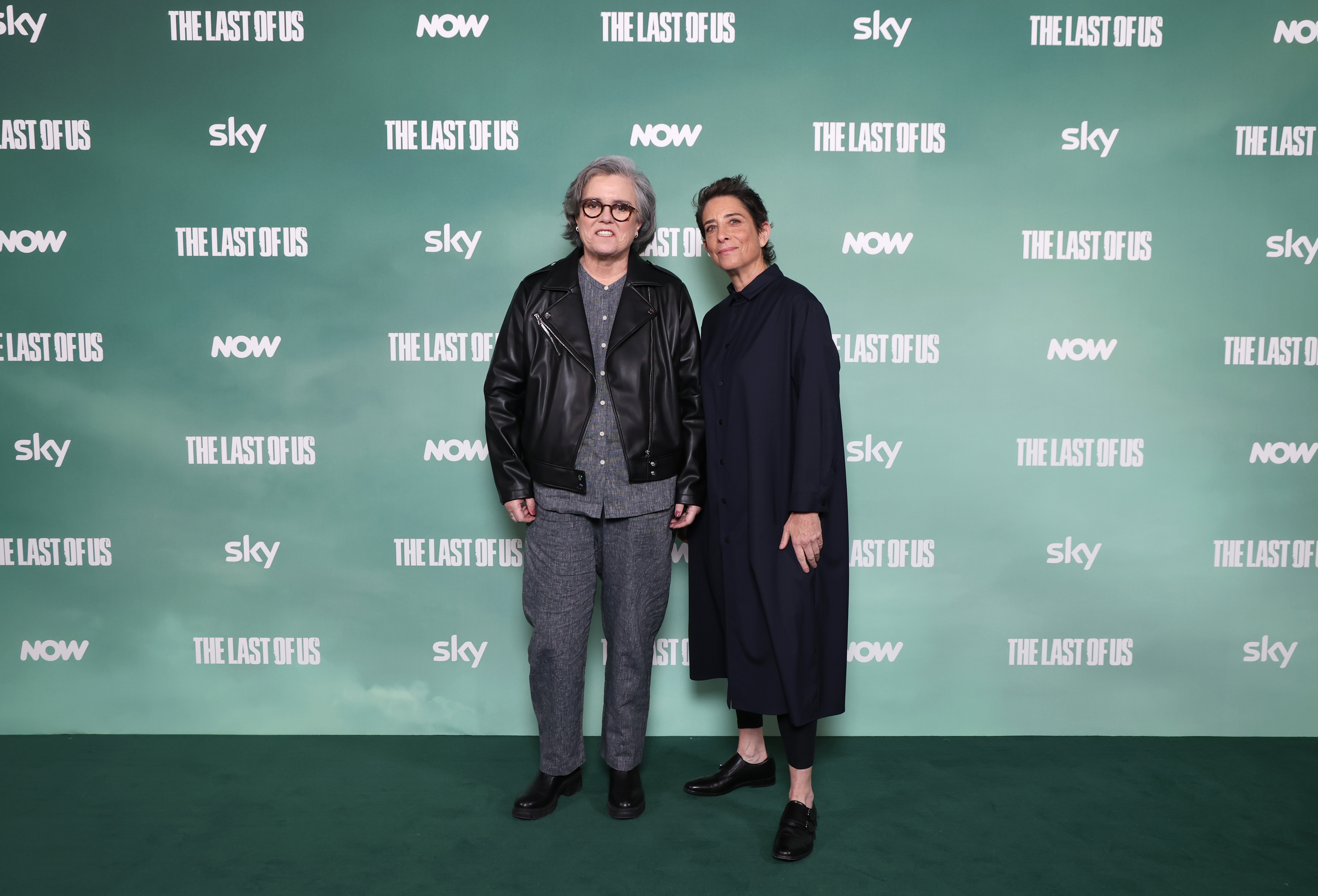 At "The Last of Us" Season 2 premiere in London on April 10, 2025, Rosie O'Donnell stood alongside Carolyn Strauss in a sleek leather jacket and gray ensemble. With her tousled silver hair and easy grin, she exuded cool confidence on the green carpet.
