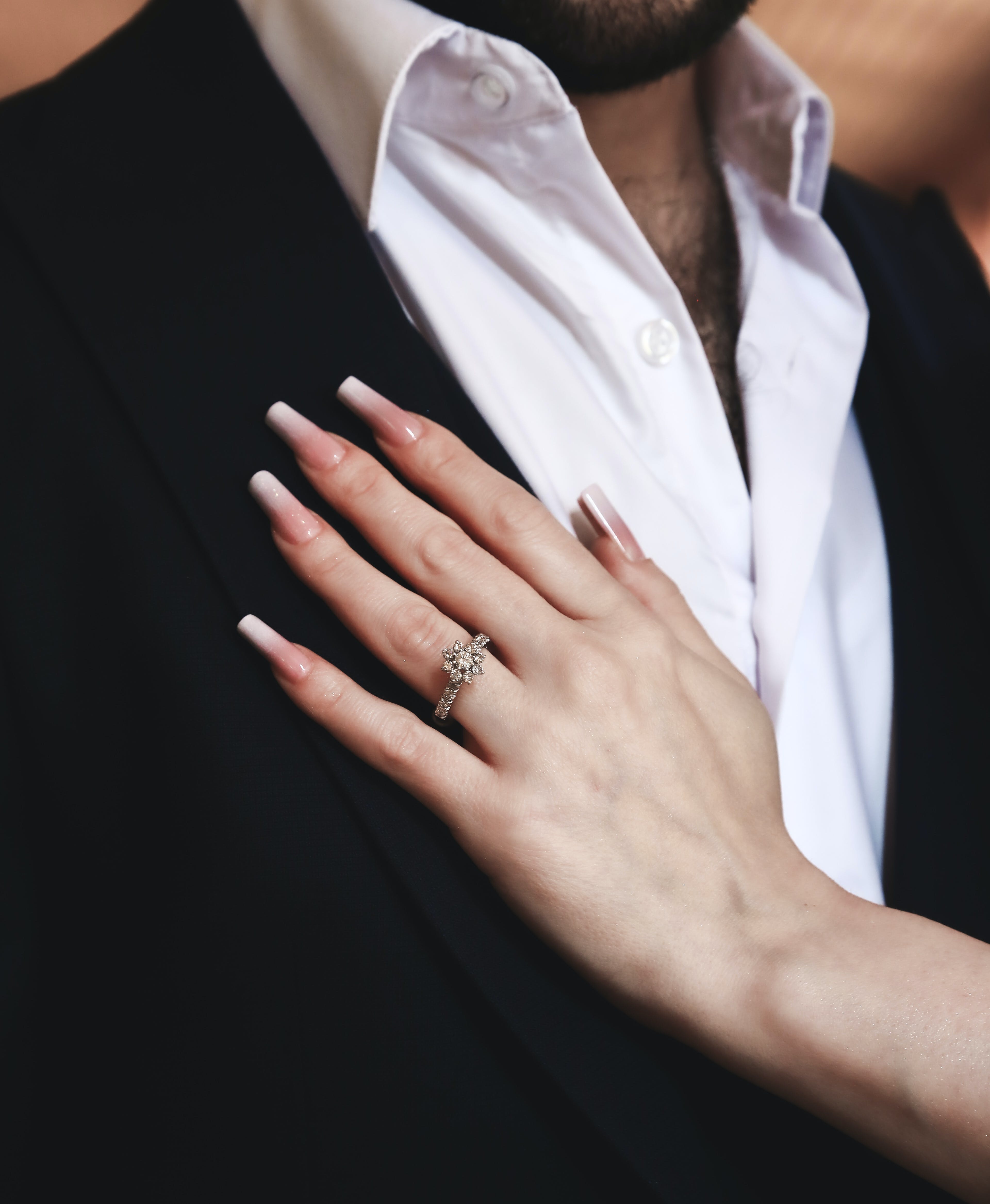 A woman resting her hand on a man's chest | Source: Pexels