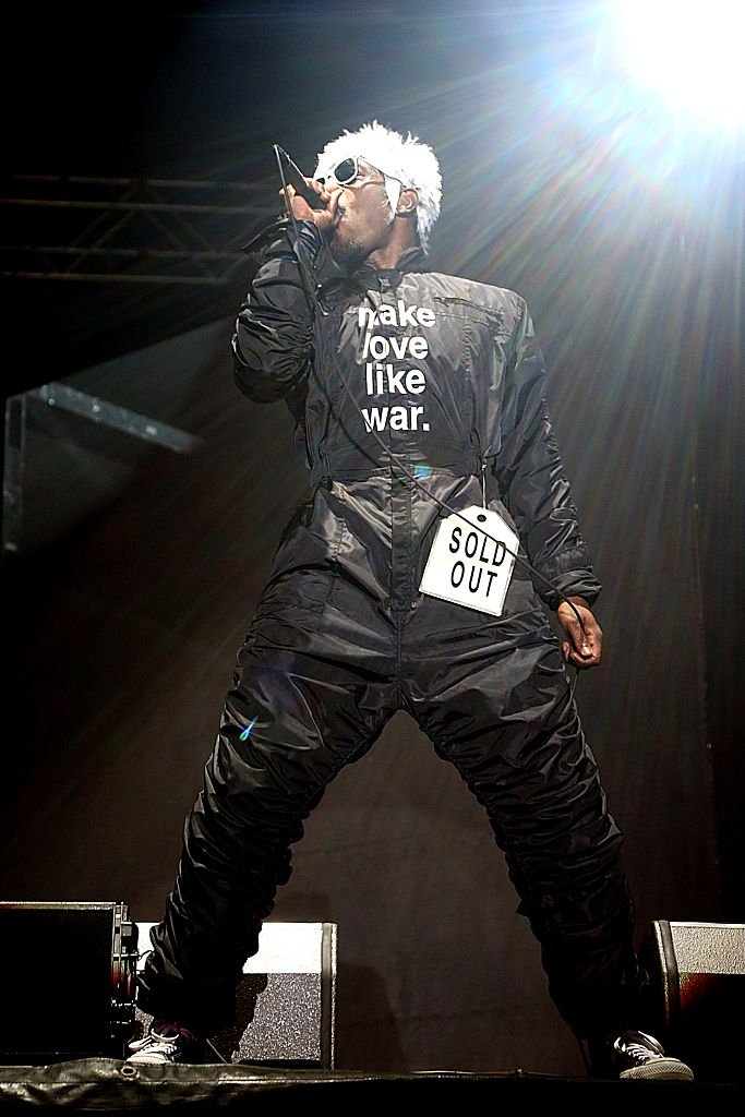 Andre 3000 wearing one of his worded jumpsuits performing on stage at the Austin City Limits Music Festival in October 2014. | Photo: Getty Images
