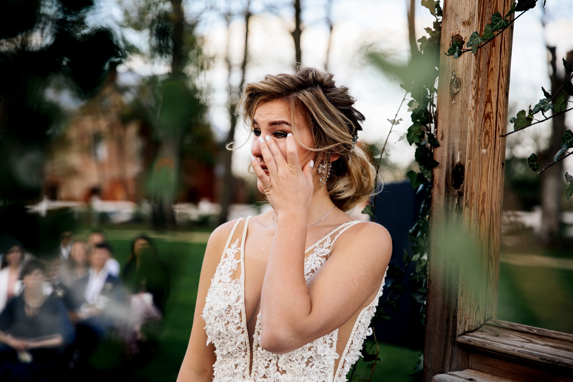 An upset bride wiping tears while crying on her wedding day | Source: Freepik