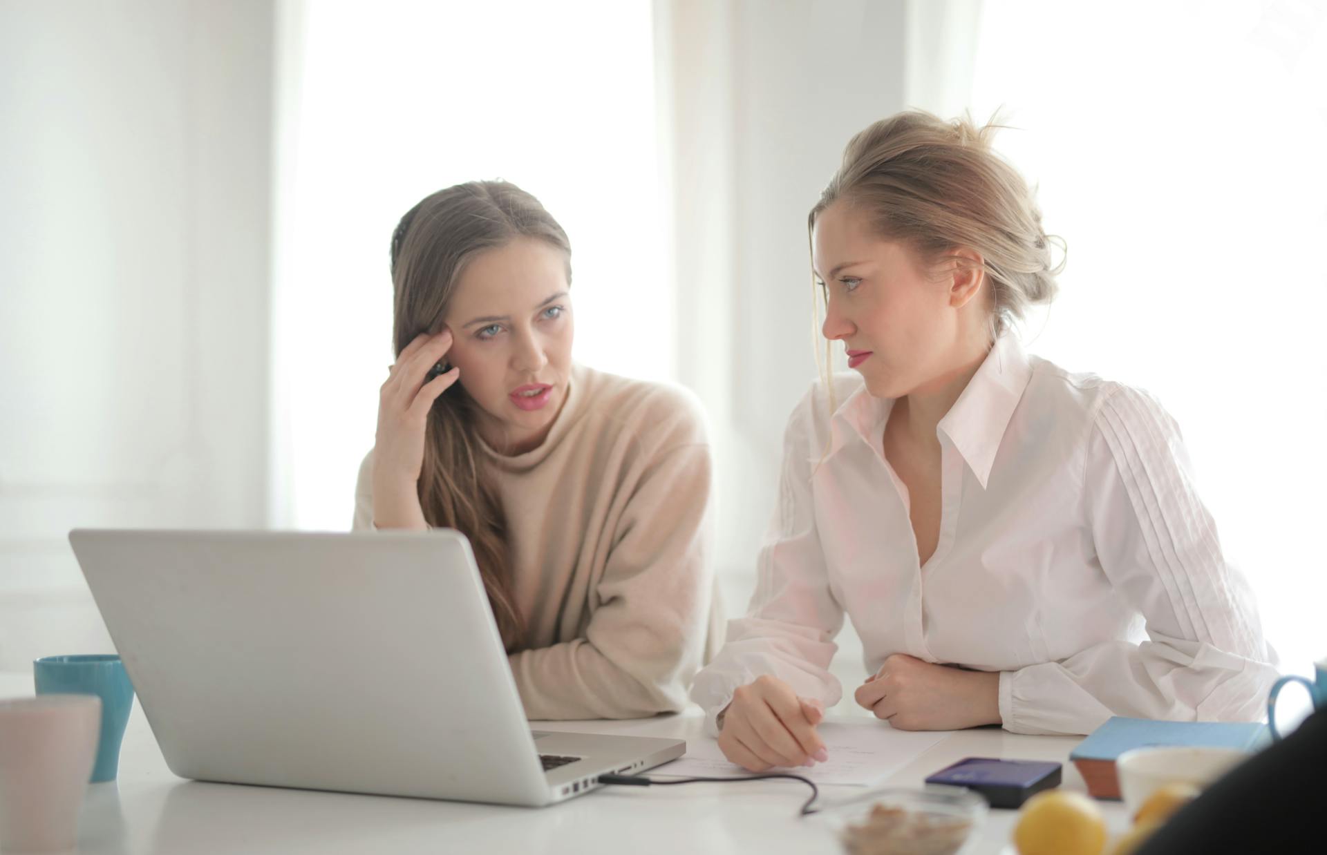 Two women talking in a workplace | Source: Pexels