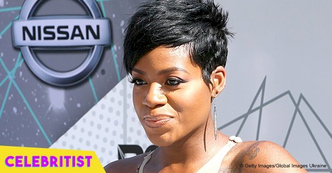 Fantasia Barrino flaunts slimmer curves in tight black dress in pic with a 'great minister'