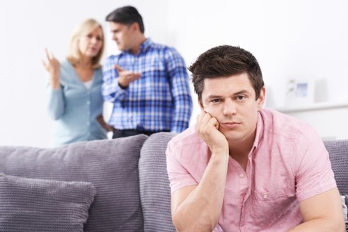 Parents frustrated with their son living at home. | Source: Shutterstock.
