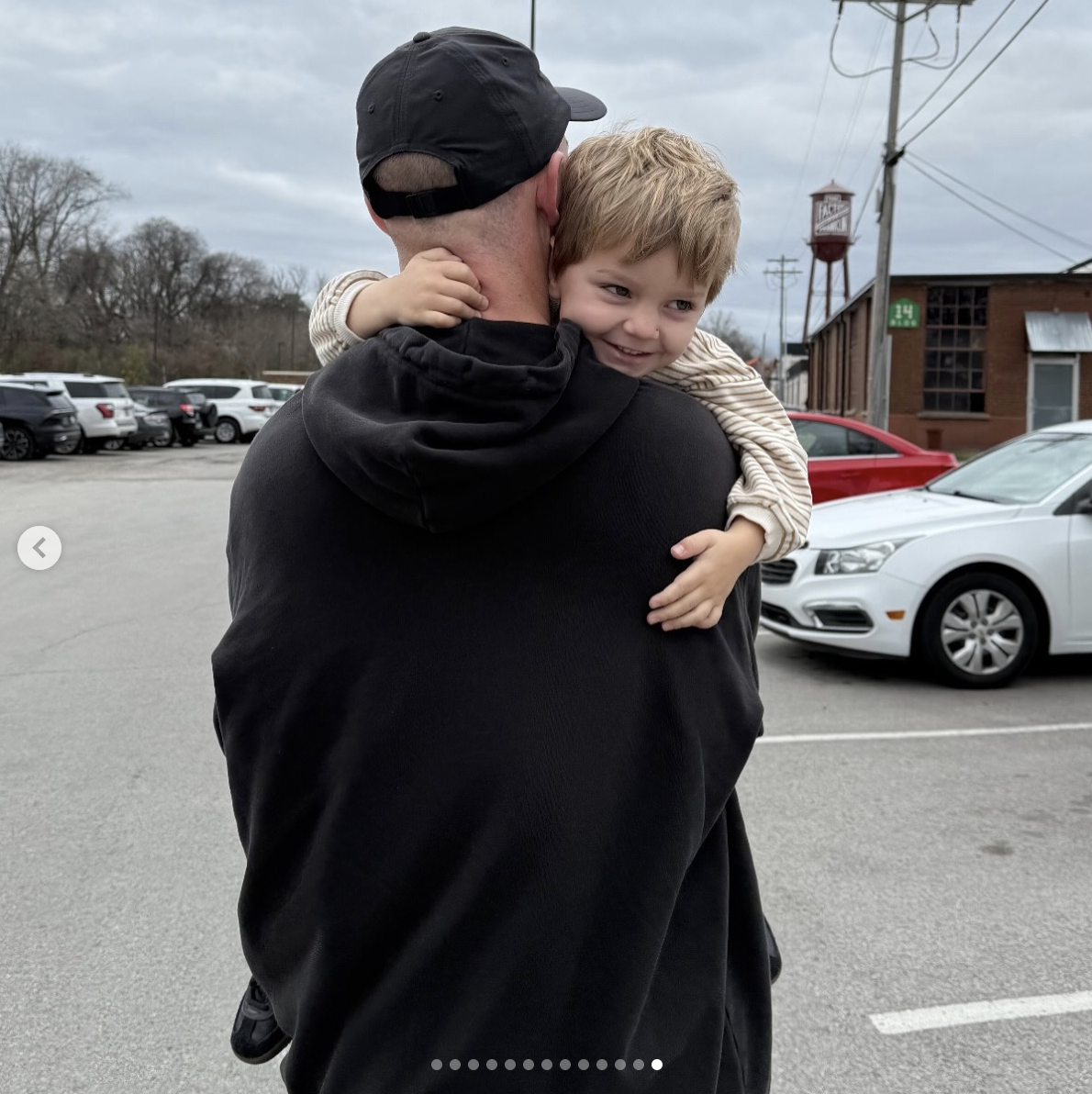 Trigg Kiser's dad, Brady, holds him while walking, as seen in a photo dated January 4, 2025 | Source: Instagram/emiliekiser