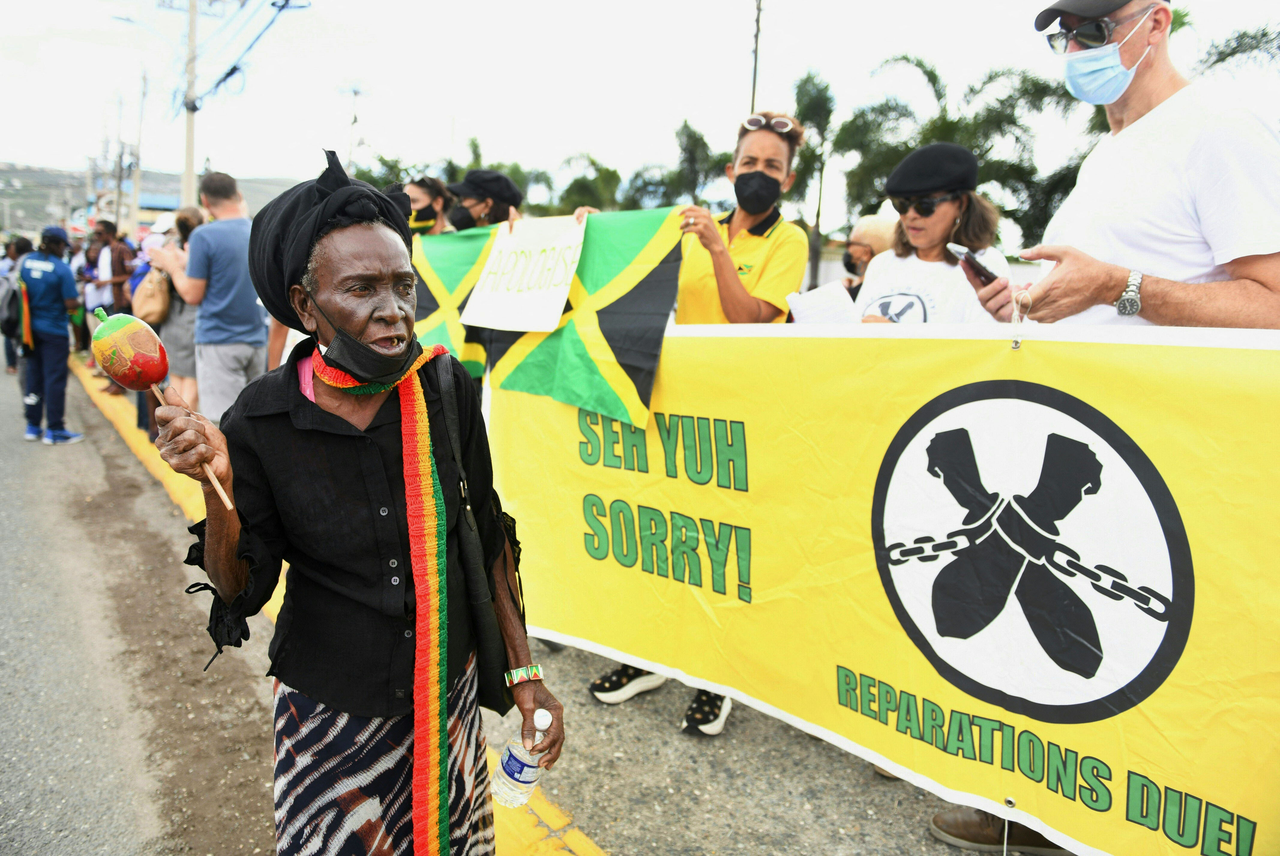 People protest outside the British High Commission during the Duke and Duchess of Cambridge's visit in Kingston, Jamaica, on March 22, 2022 | Source: Getty Images