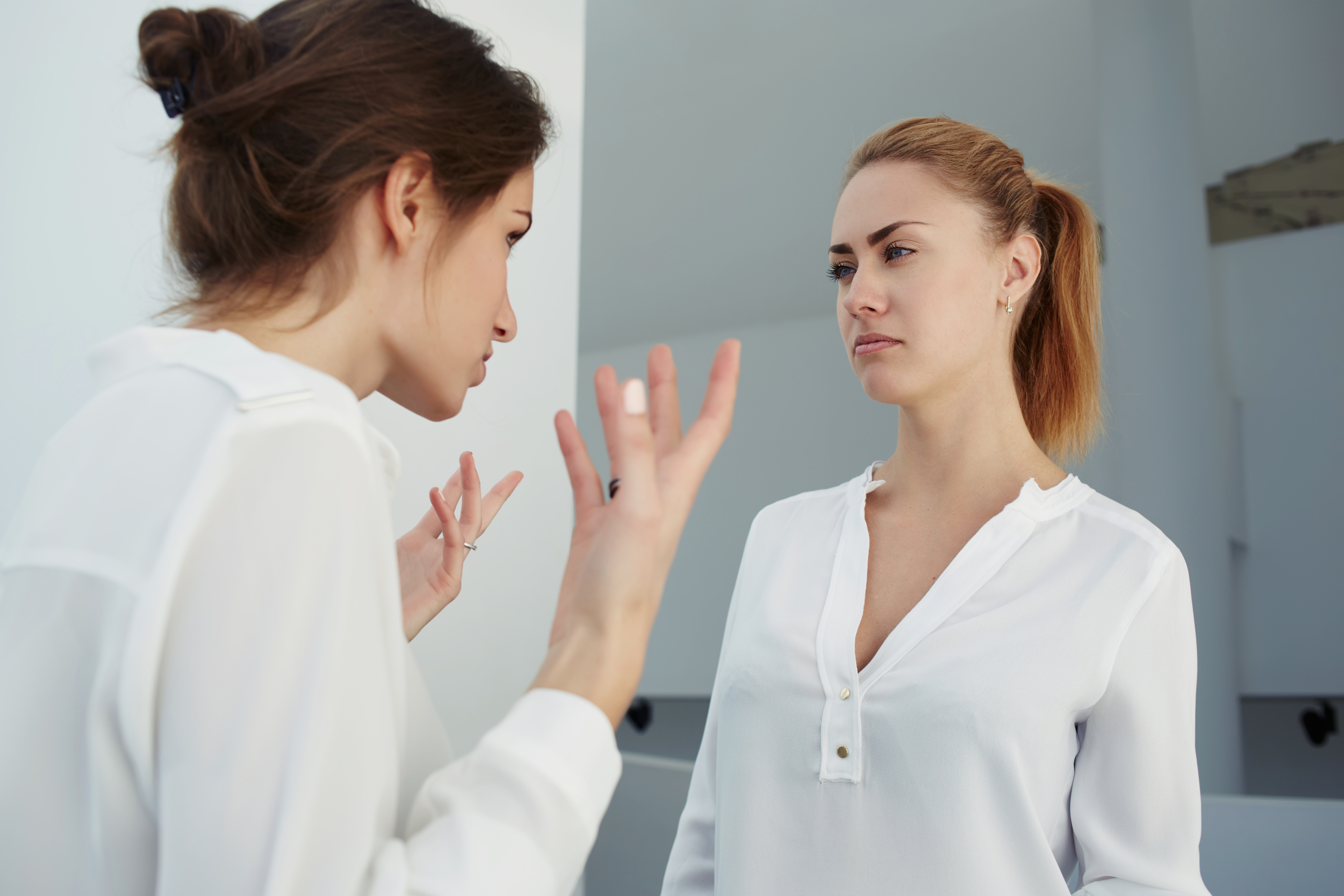 A boss reprimanding employee | Source: Shutterstock