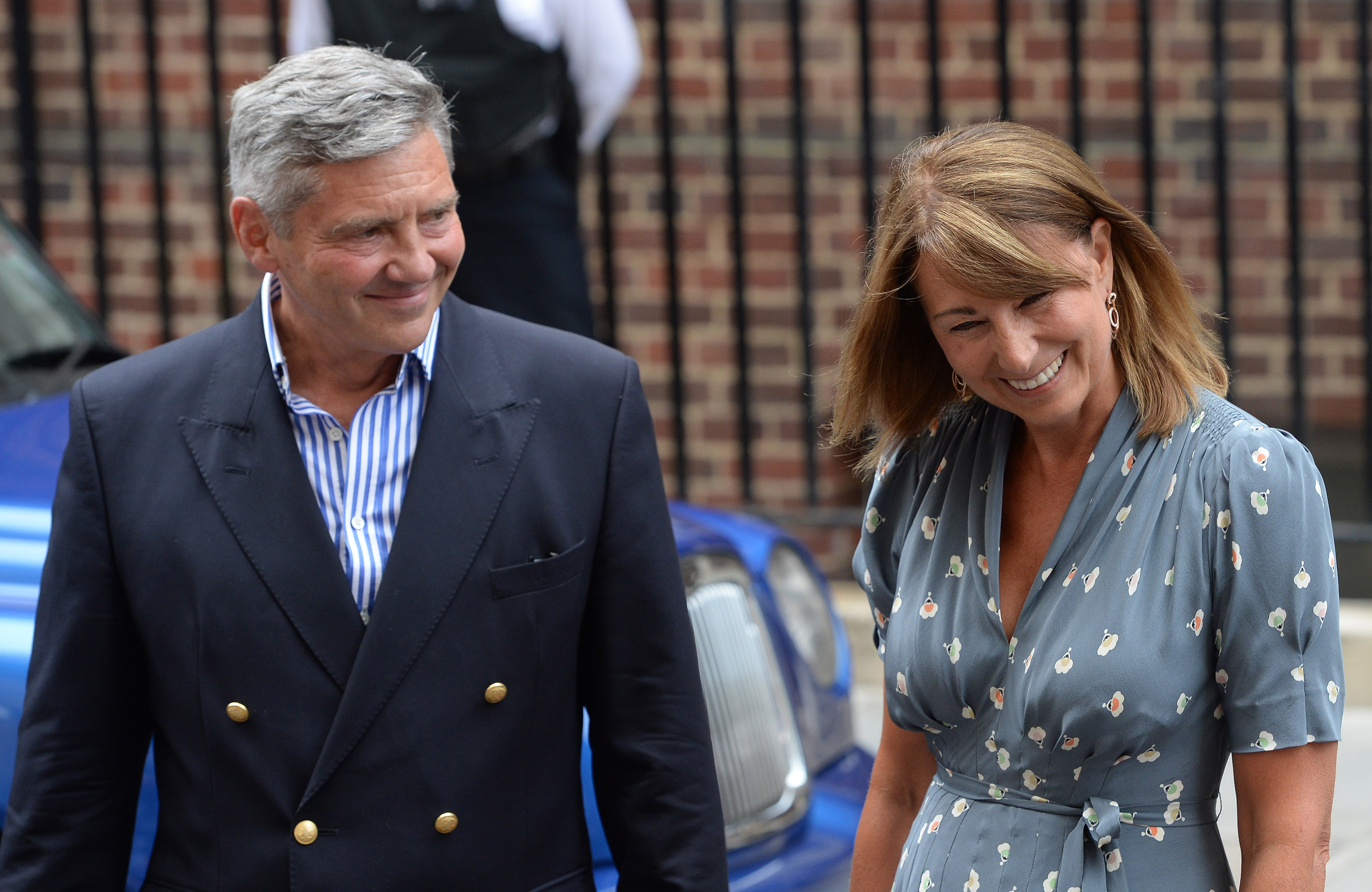 Carole Middleton and Michael Middleton arrive to see Catherine, Duchess of Cambridge and Prince William, Duke of Cambridge and their newborn son at the Lindo Wing at St Mary's Hospital in London, England, on July 23, 2013. | Source: Getty Images