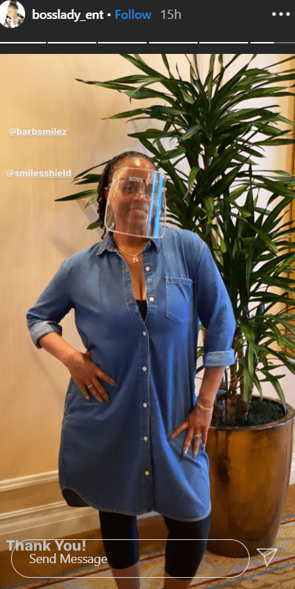 Shante Broadus poses for a picture in a denim dress and a face shield. | Photo: Instagram/bosslady_ent