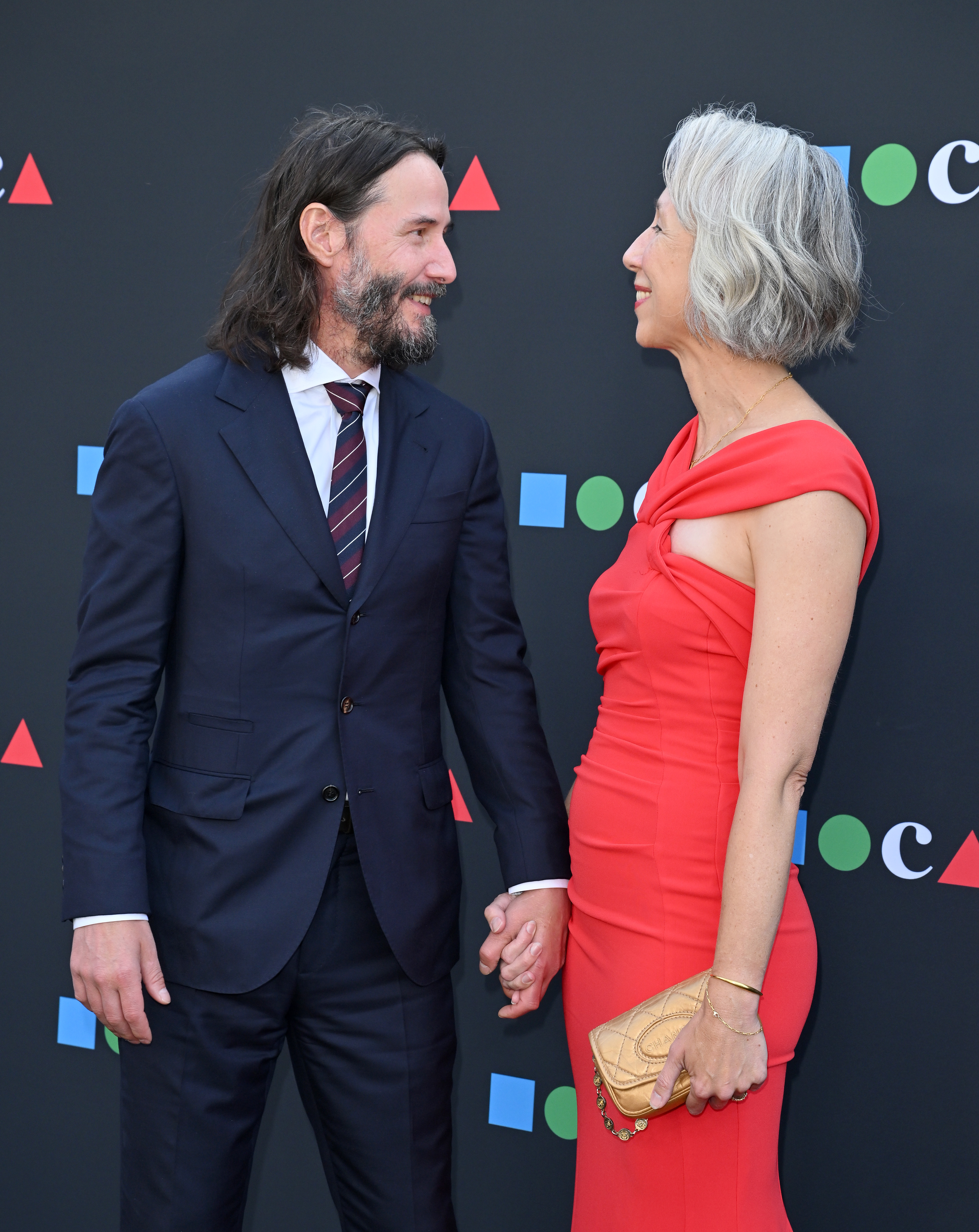 Keanu Reeves and Alexandra Grant smiling at each other at the 2022 MOCA Gala. | Source: Getty Images