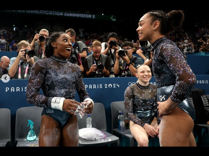 Hezly "Hez" Rivera, Simone Biles, and another teammate at the Paris Olympics in a social media post uploaded on July 29, 2024 | Source: Instagram/hezrivera and usagym