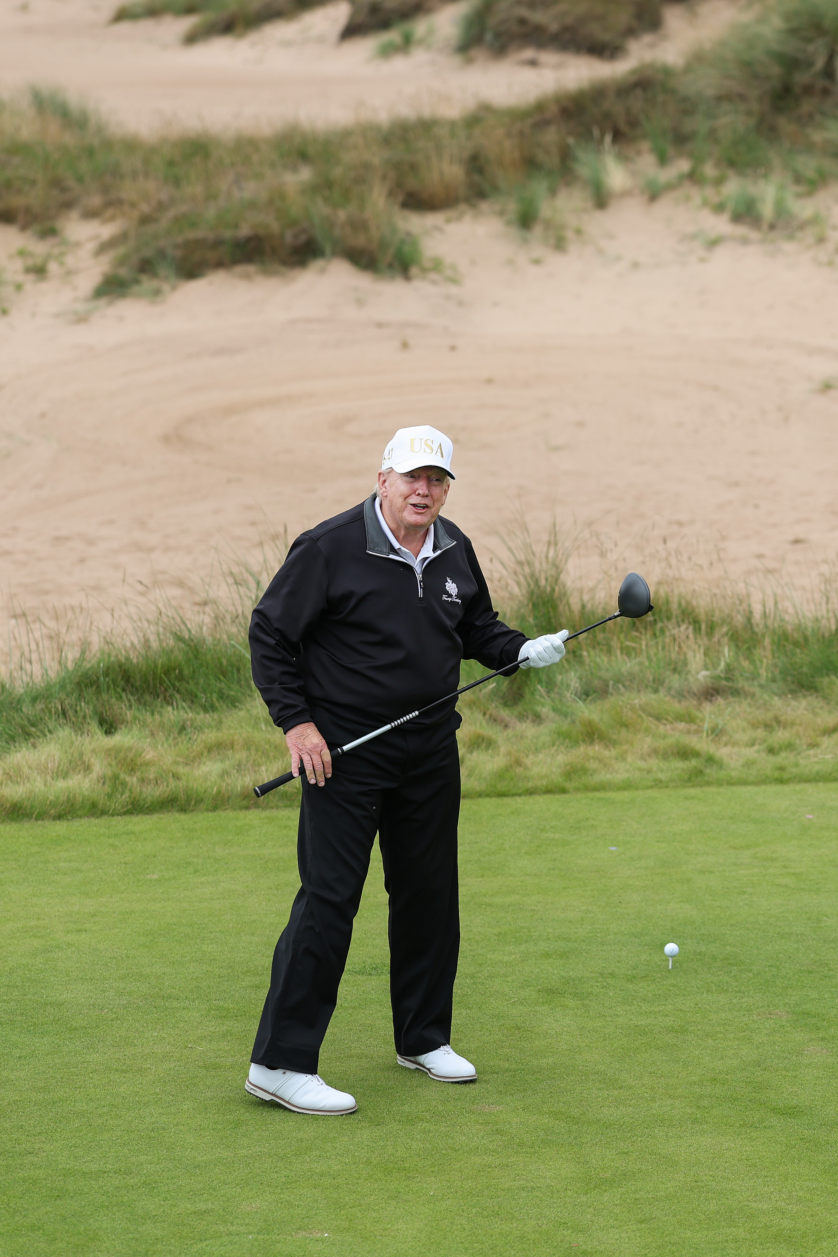 President Donald Trump tees off after opening his new golf course in Scotland on July 29, 2025 | Source: Getty Images
