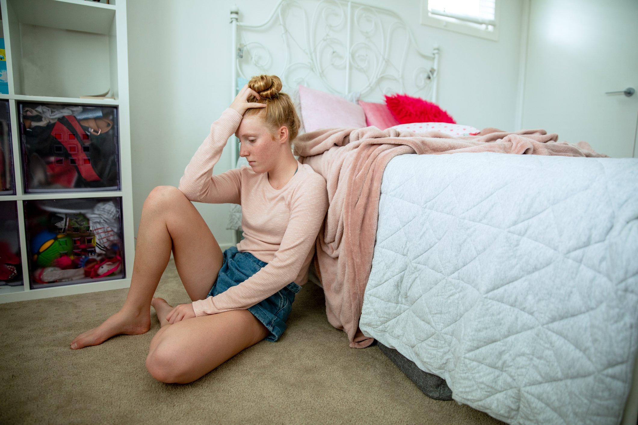 Teenage girl in her bedroom showing a range of emotions | Photo: Getty Images