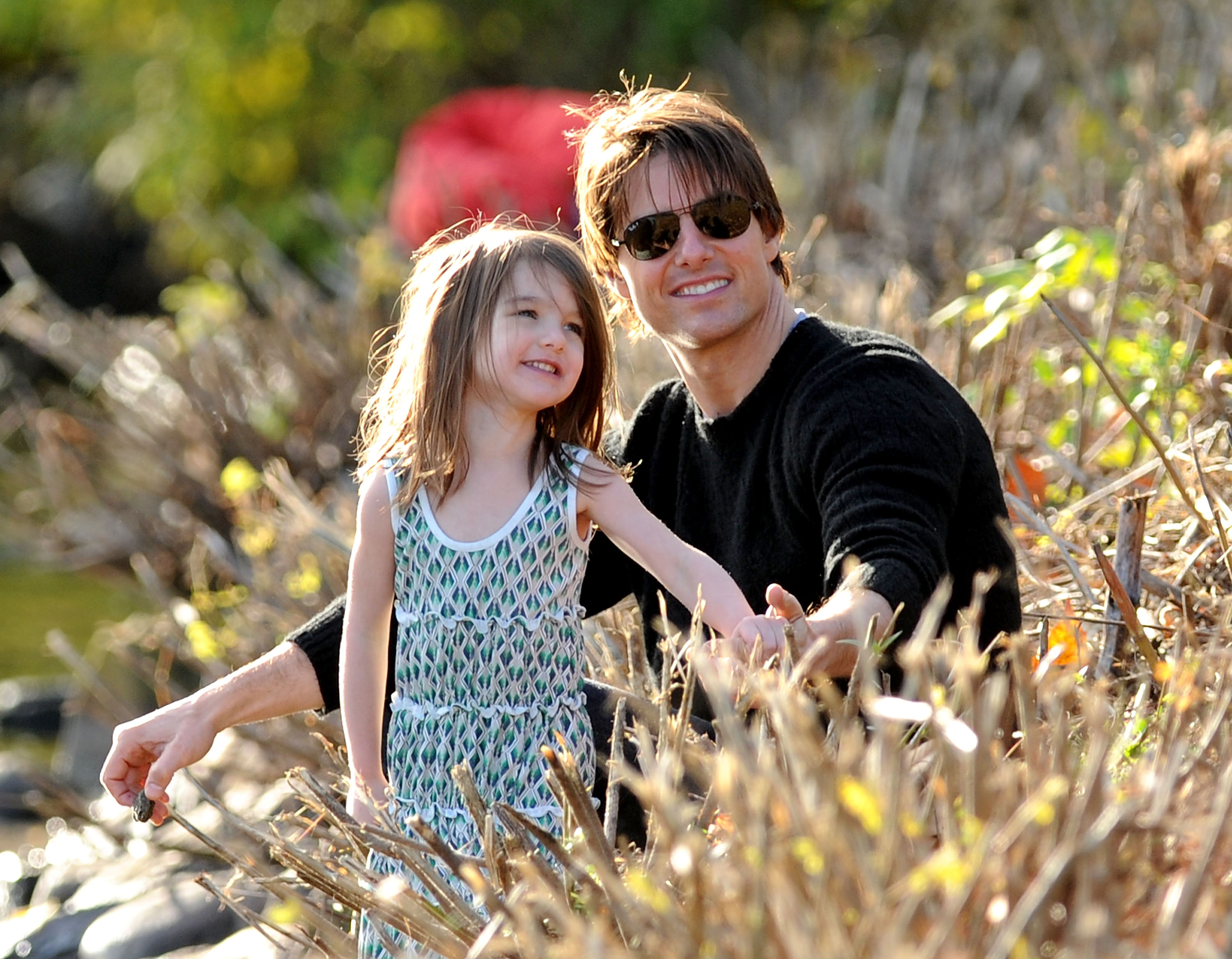 Tom Cruise and Suri Cruise spend time together at the Charles River Basin during a father-daughter outing in Cambridge, Massachusetts. | Source: Getty Images