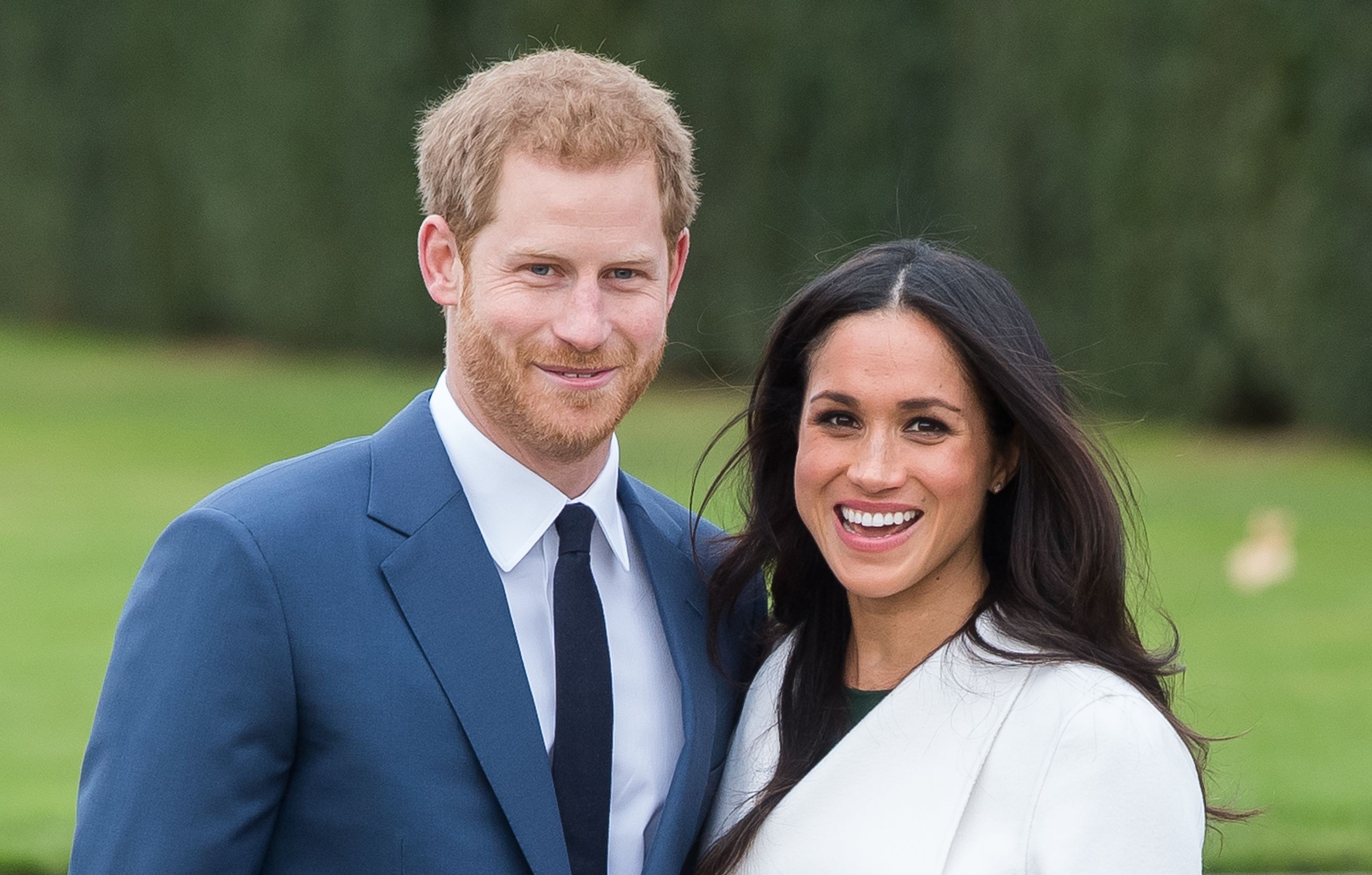 Prince Harry and Meghan Markle during an official photocall to announce their engagementat The Sunken Gardens at Kensington Palace in London, England | Photo: Getty Images