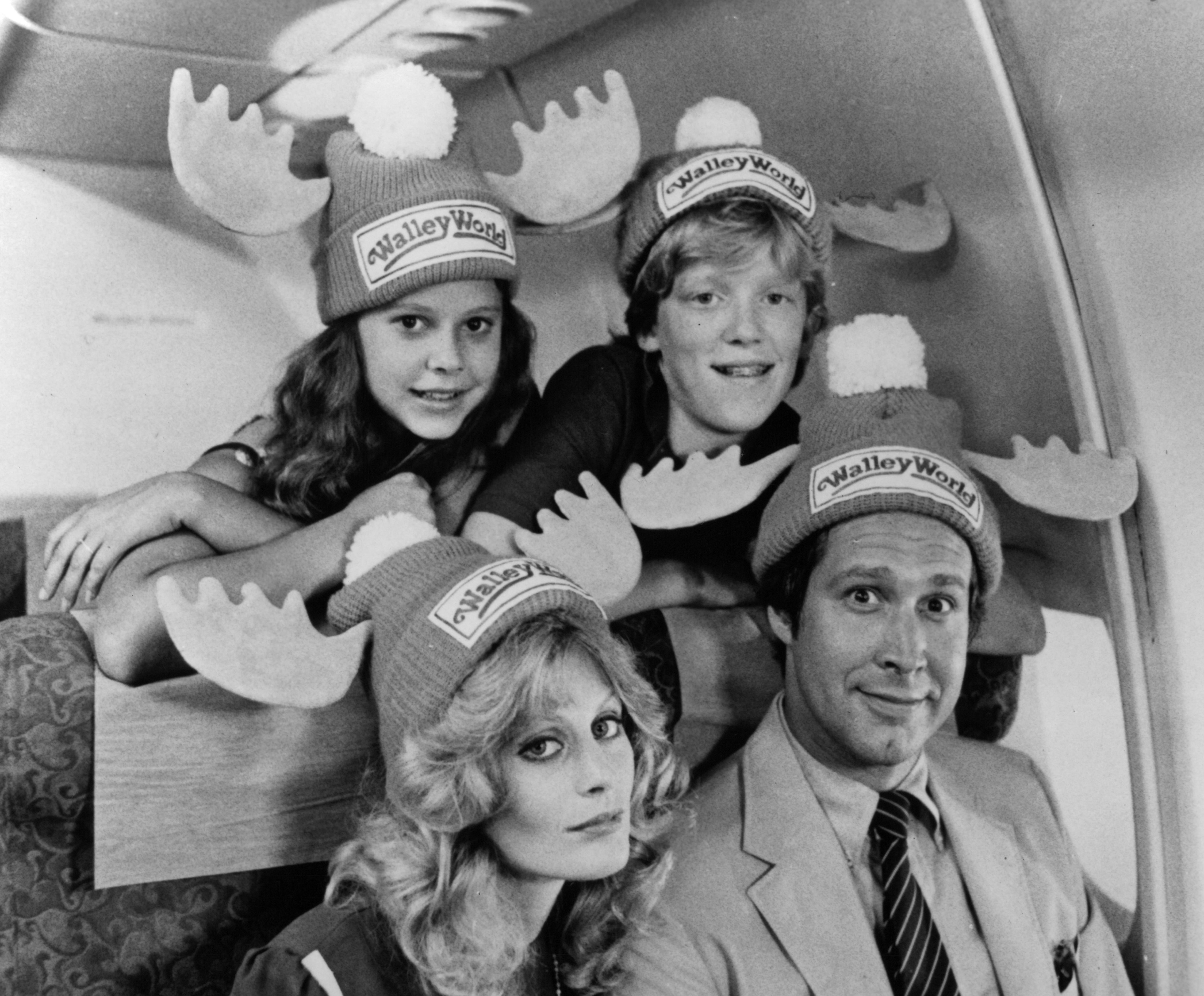 Dana Barron, Anthony Michael Hall, Beverly D'Angelo, and Chevy Chase pose for the Warner Bros. movie "National Lampoon's Vacation," in 1983. | Source: Getty Images