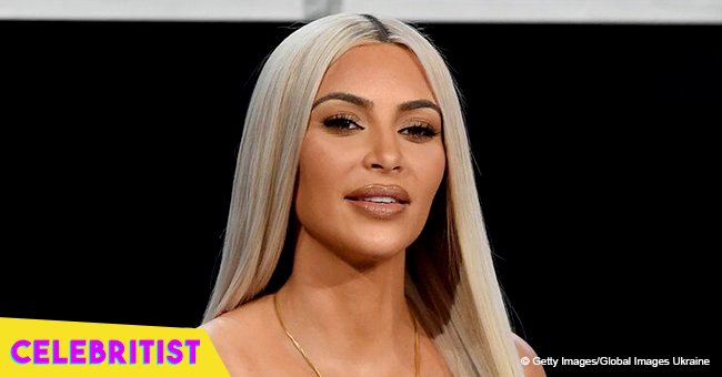 Kim Kardashian is all smiles while being lifted into the air in photo from Kanye West's party