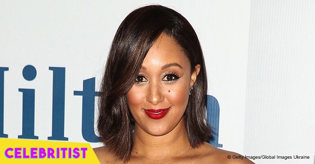 Tamera Mowry switches up her look with straightened hair & classy pantsuit in recent pic