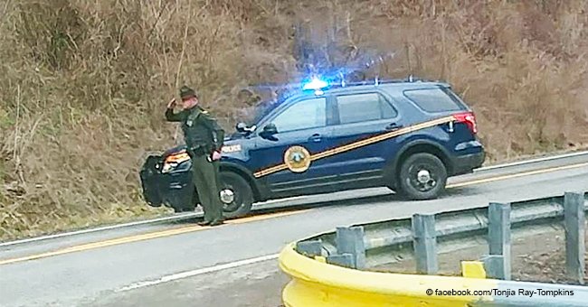 Photo of trooper paying tribute to a funeral procession with a salute quickly goes viral