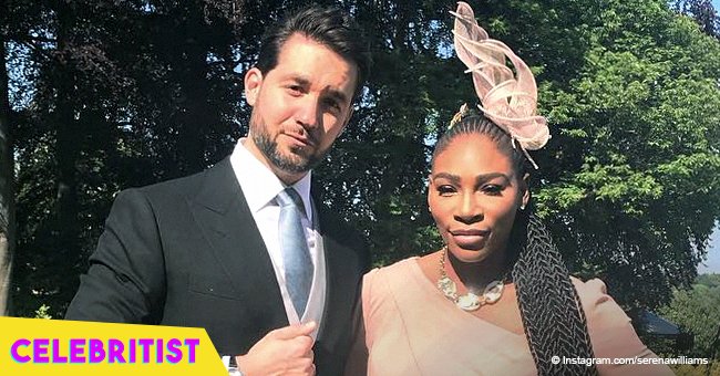 Alexis Ohanian embraces wife Serena Williams while posing on the rooftop of a house