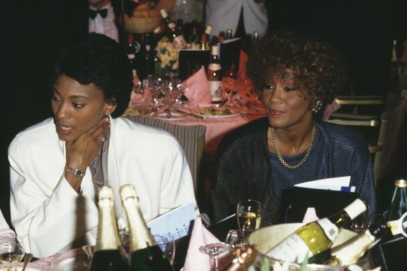 Robyn Crawford and American singer Whitney Houston at an event | Photo: Getty Images