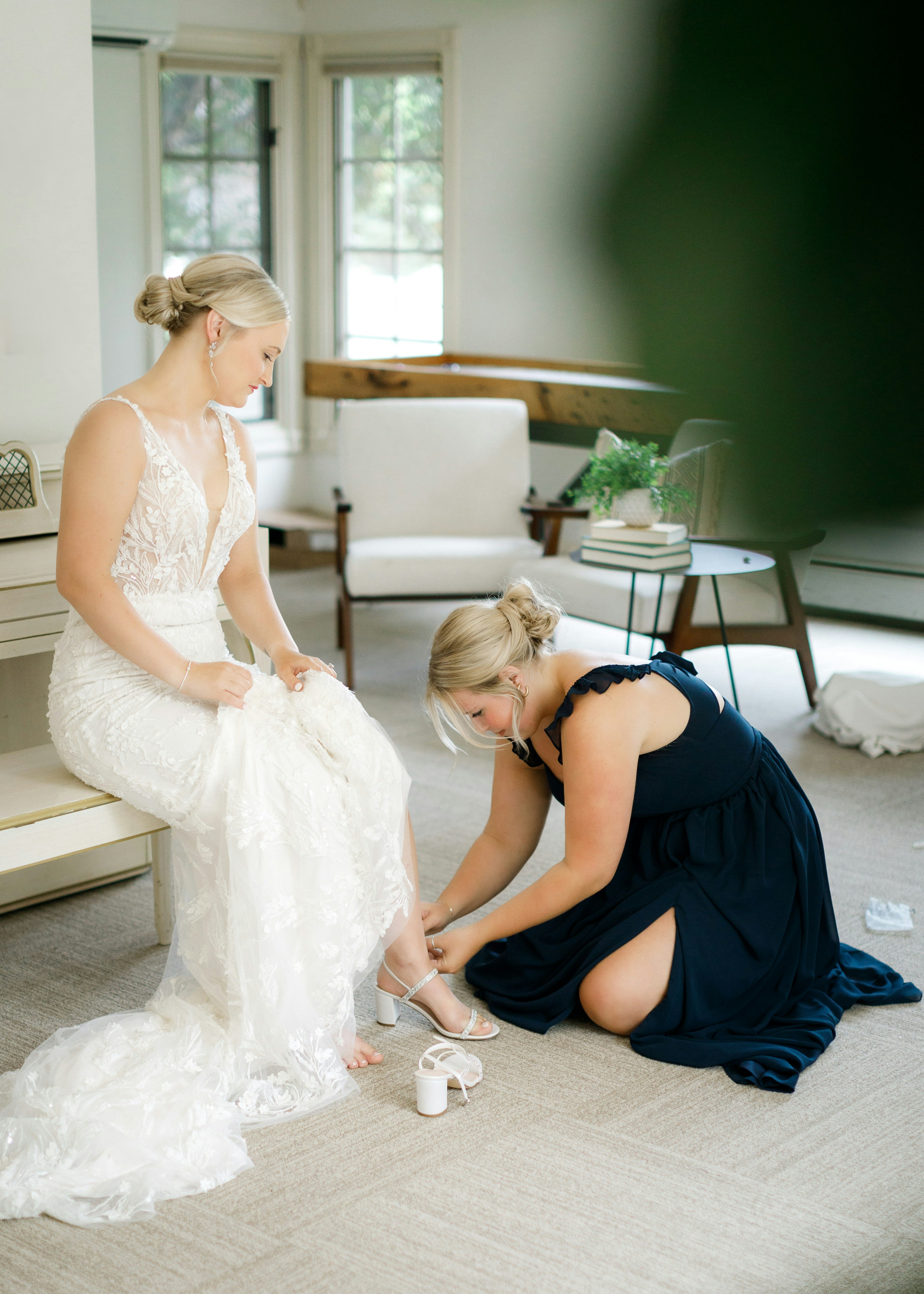 A bridesmaid helping the bride | Source: Unsplash