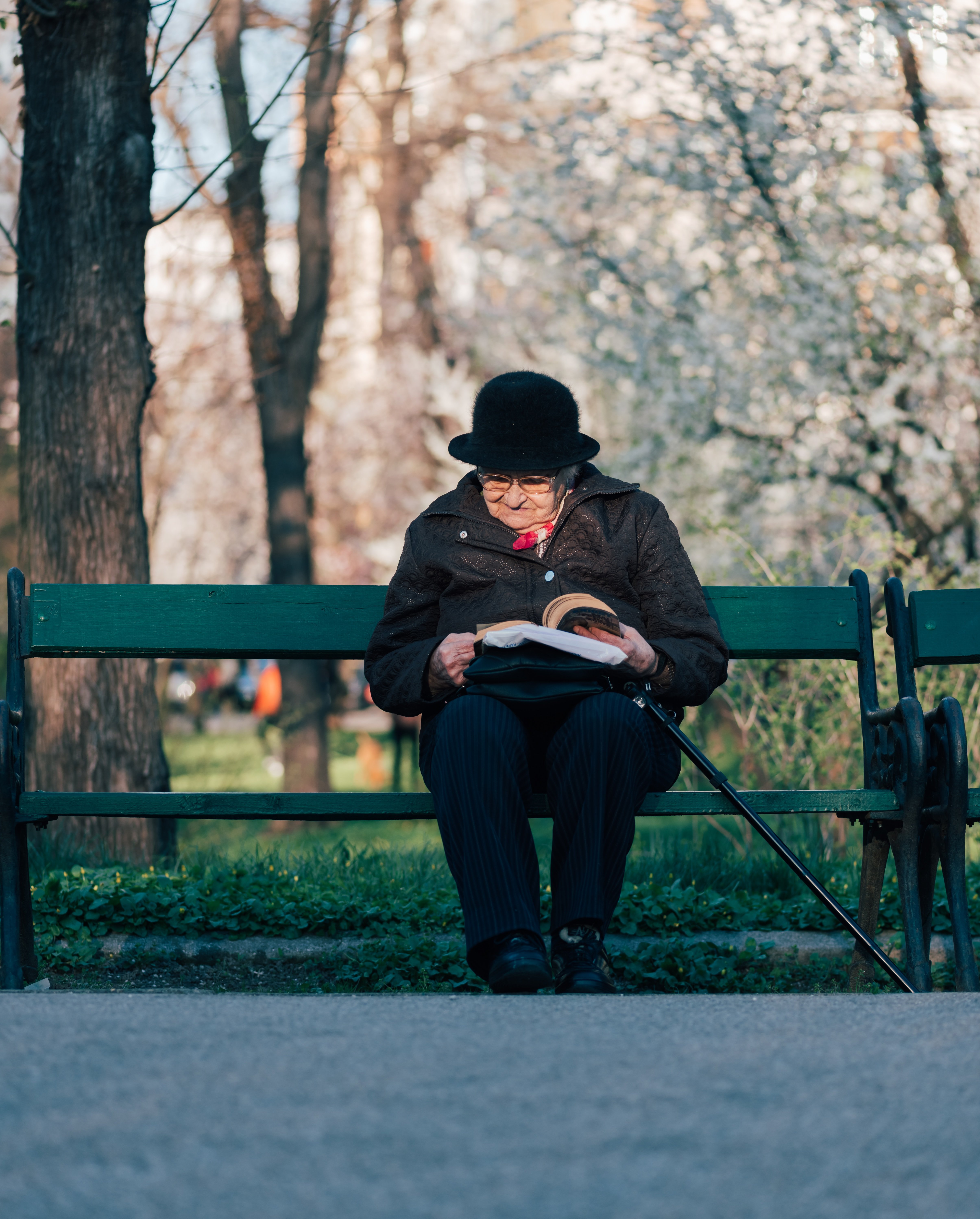 An ageing mother taking a moment to read over her letter| Photo by Alex Blăjan on Unsplash