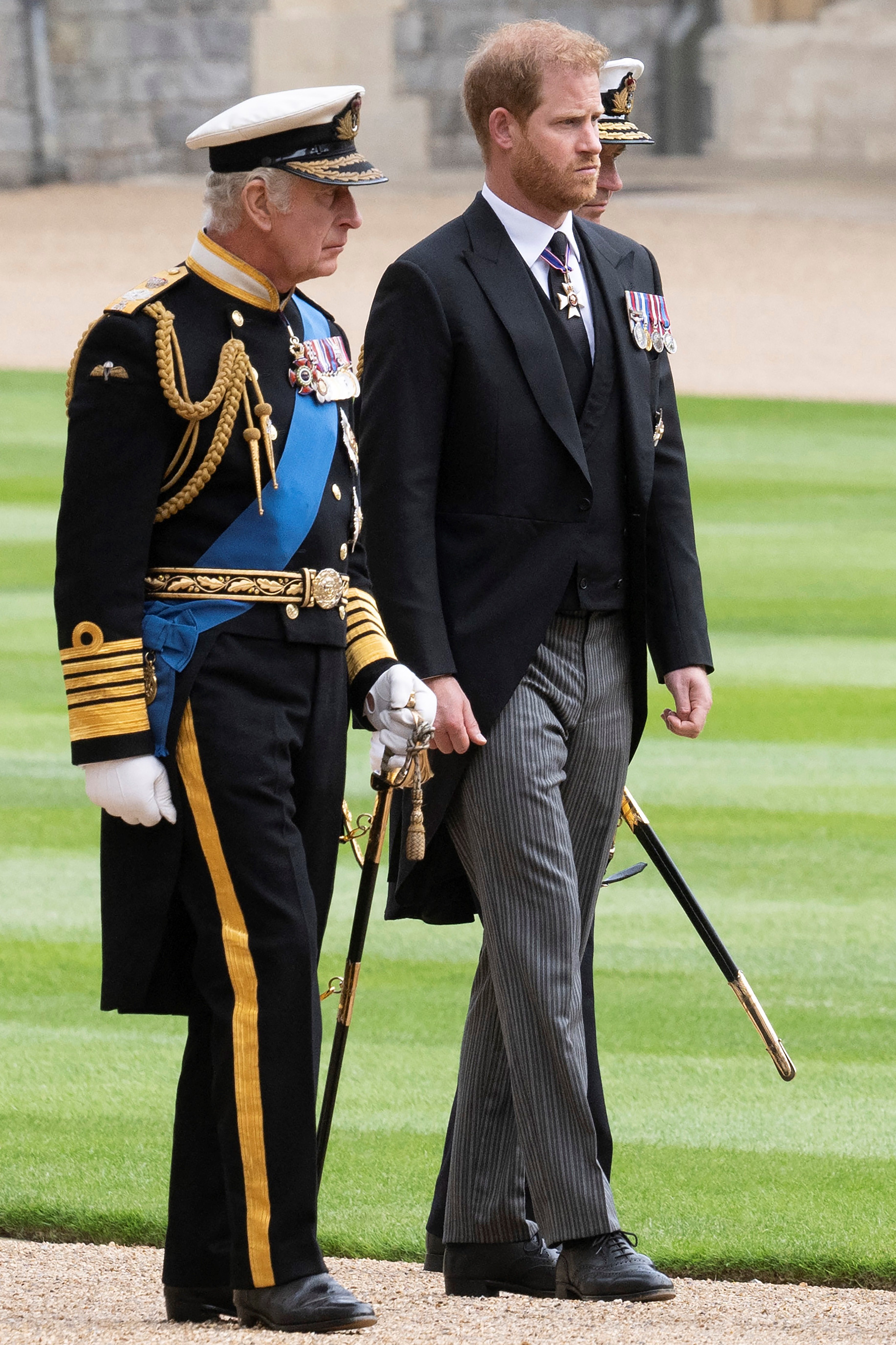 Britain's King Charles III (L) walks with his son Britain's Prince Harry, Duke of Sussex as they arrive at St George's Chapel inside Windsor Castle on September 19, 2022 | Source: Getty Images
