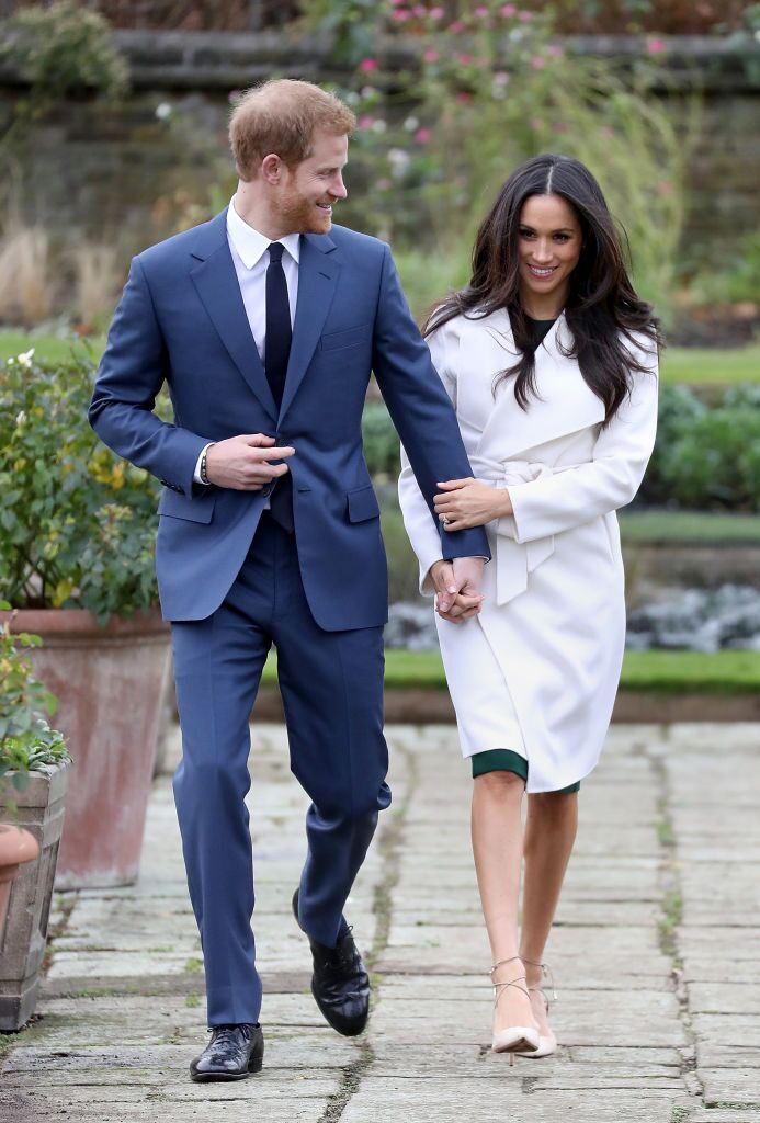 Prince Harry and actress Meghan Markle during an official photocall to announce their engagement at The Sunken Gardens at Kensington Palace  | Photo: Getty Images