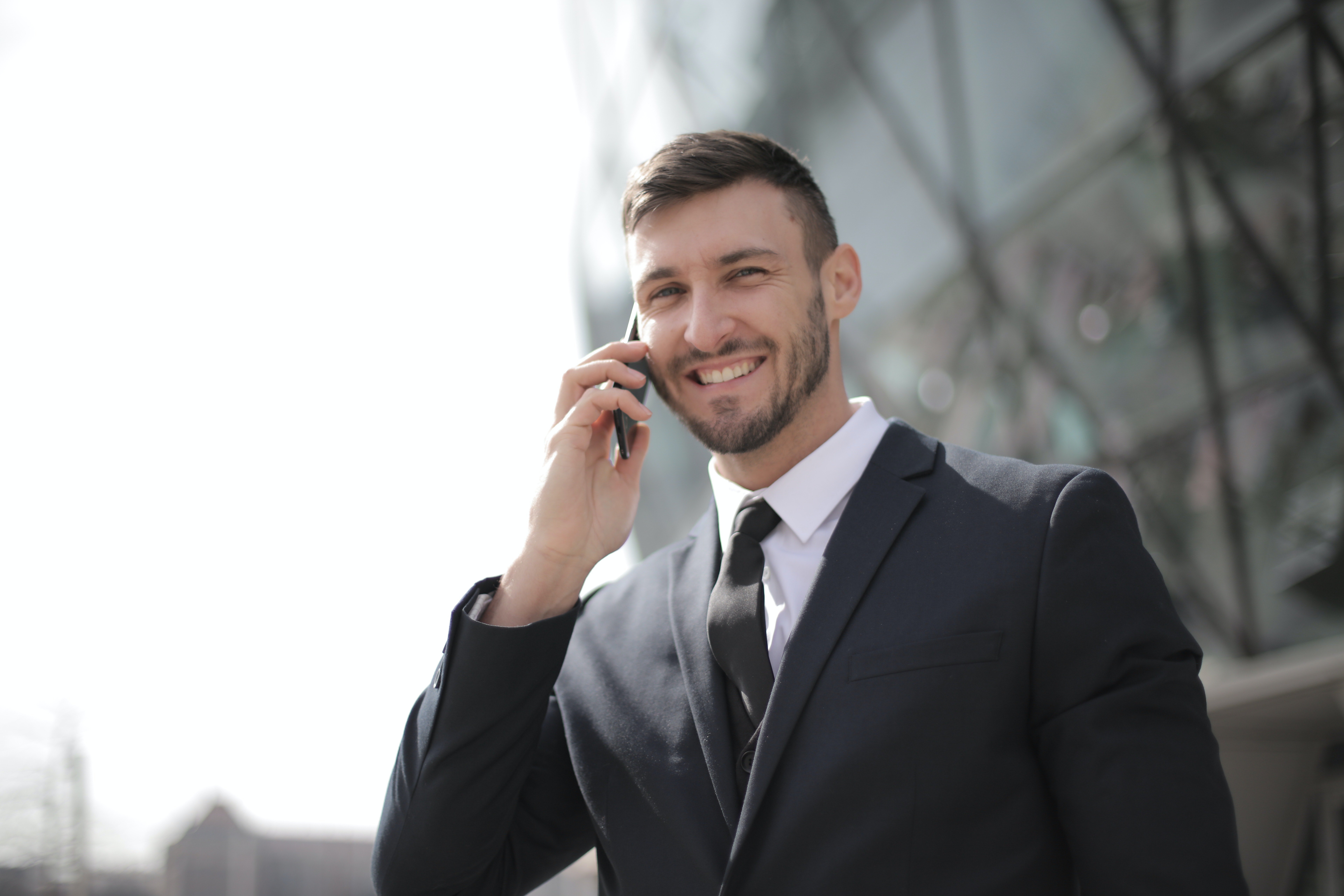 A man in a business suit was walking on the street when his wallet fell out of his pocket. | Source: Pexels