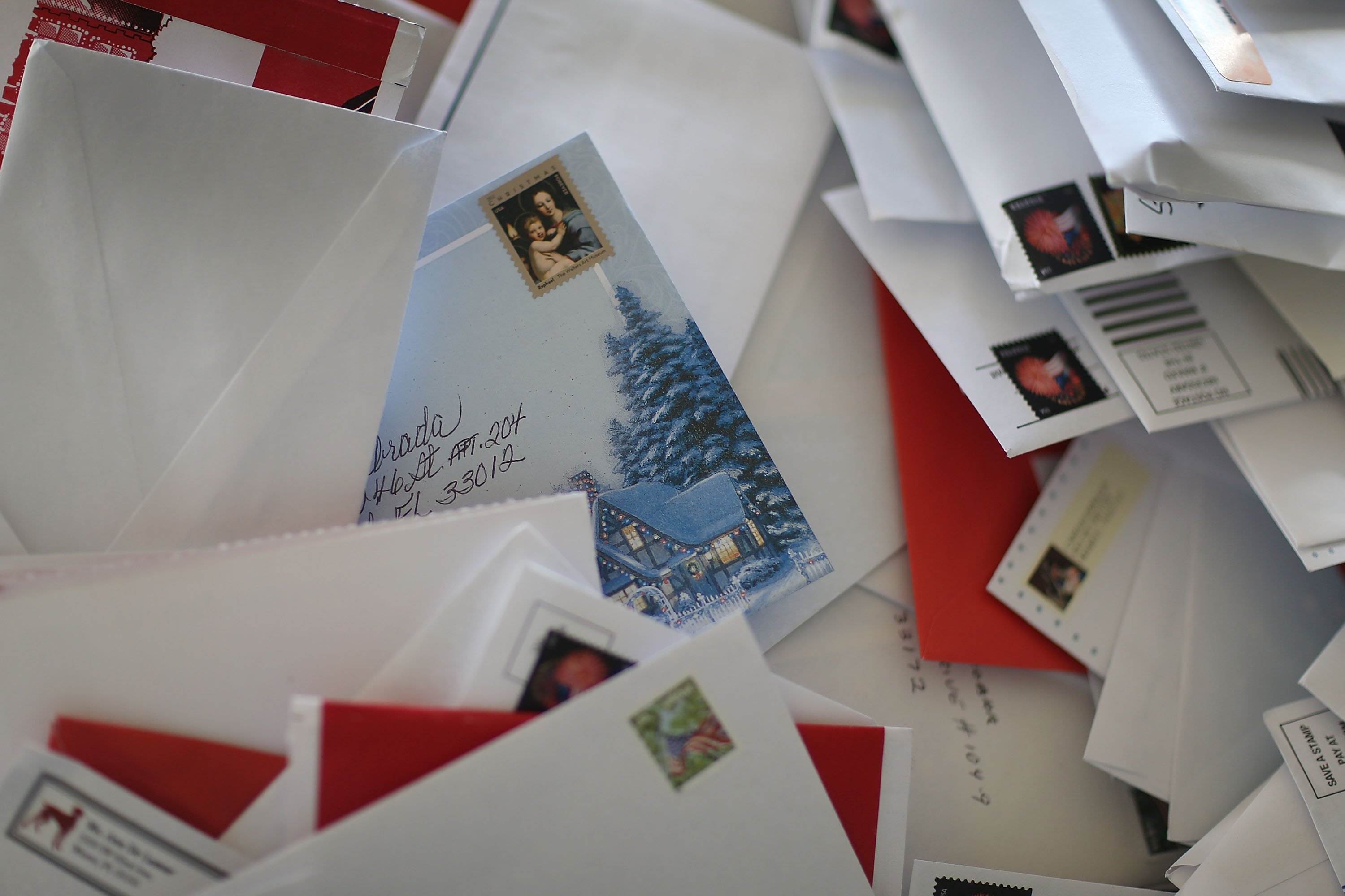 Holiday card among plenty of letters | Source: Getty Images