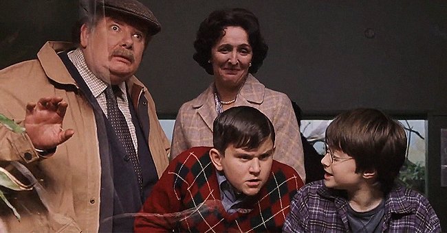 Richard Griffiths, Harry Melling, Fiona Shaw, and Daniel Radcliffe in a scene from "Harry Potter and the Philosopher's Stone" | Photo: Youtube.com/bloom